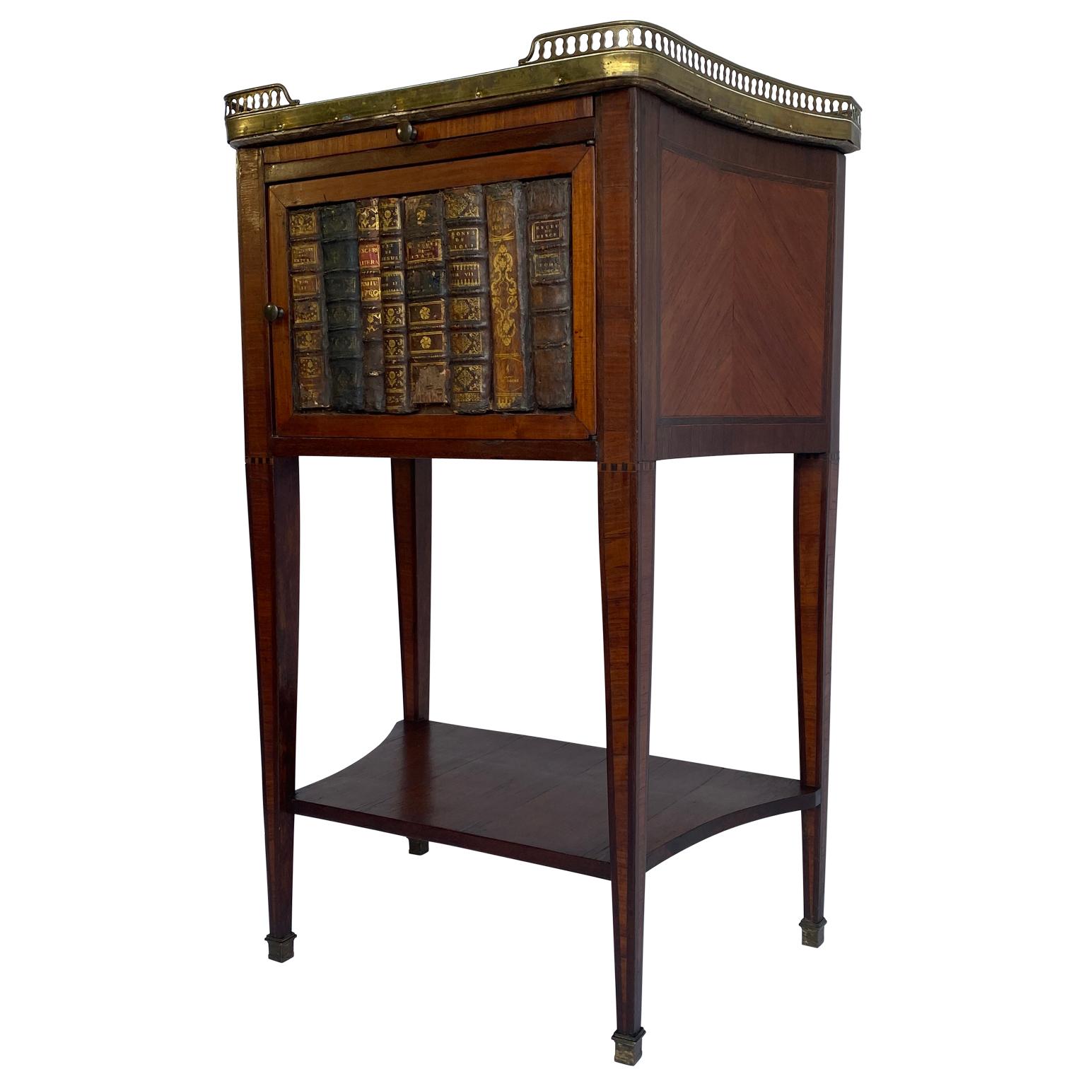 French 1860s Napoleon III period brass gallery rail side table with marble top and library bookends as decoration.
Hand written provenance on the rear side: 