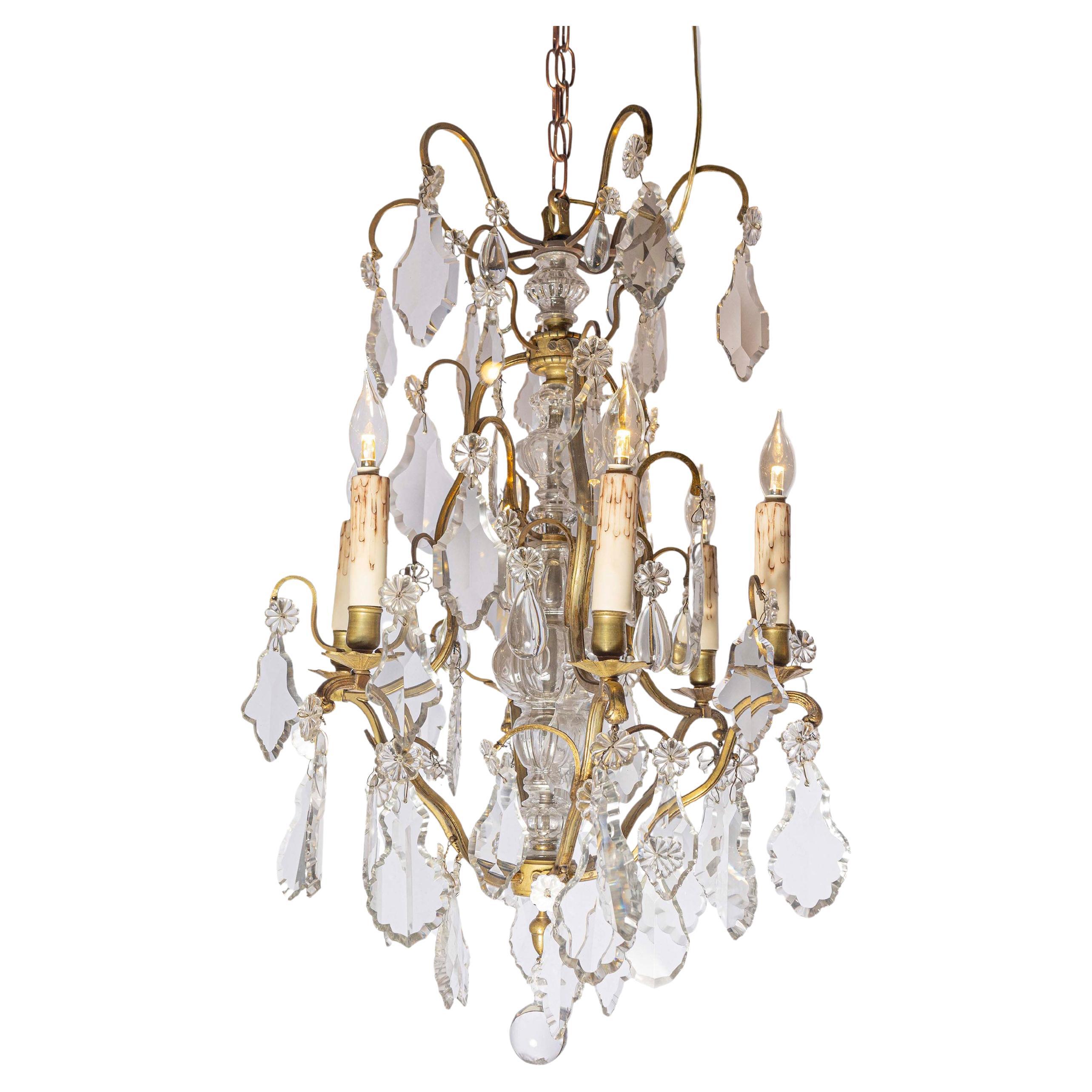 French 19th Century Six-Light Bronze and Crystal Chandelier with Scrolling Arms