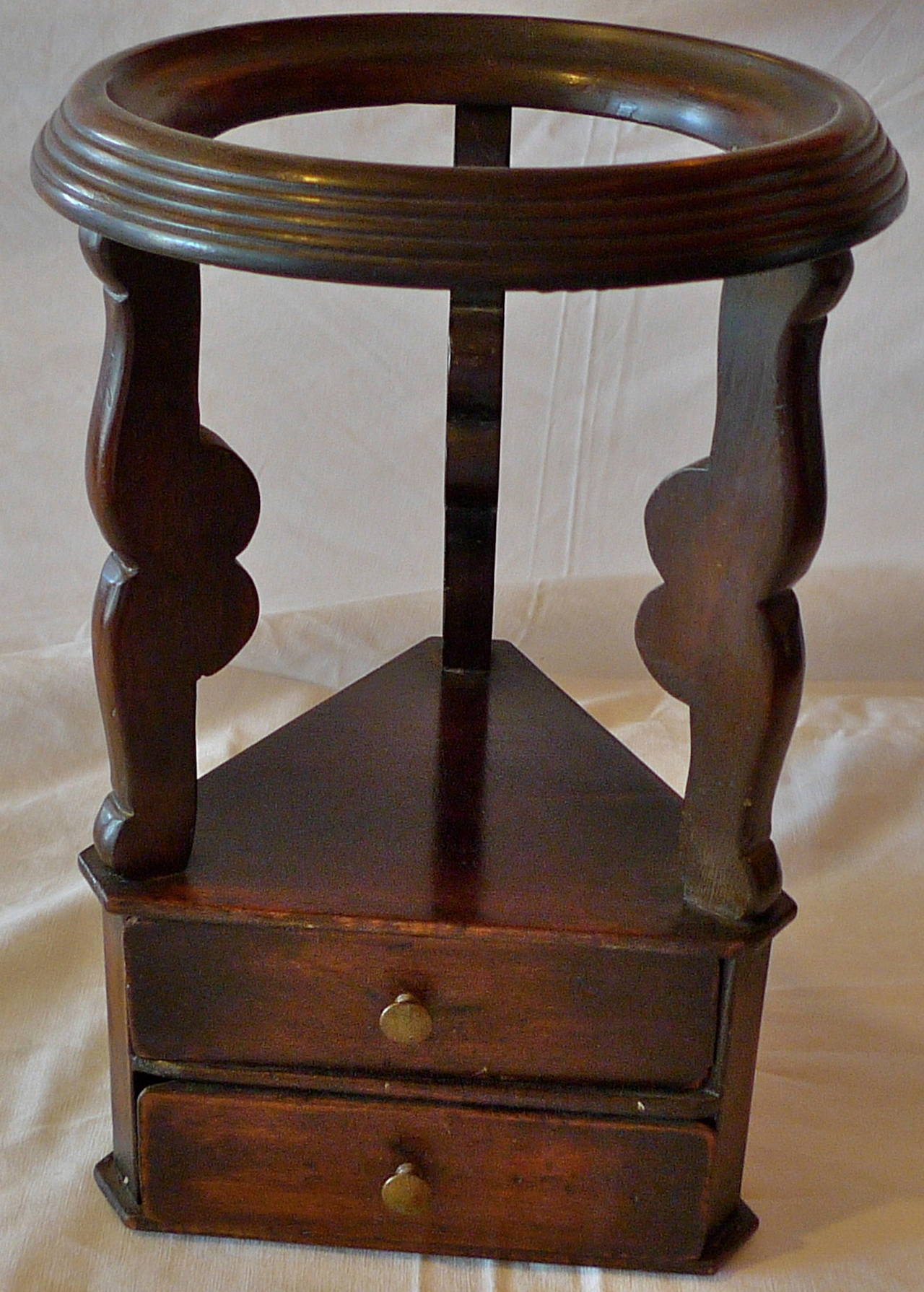 French 19th century small mahogany triangle cabinet with two drawers and round plate stand.
