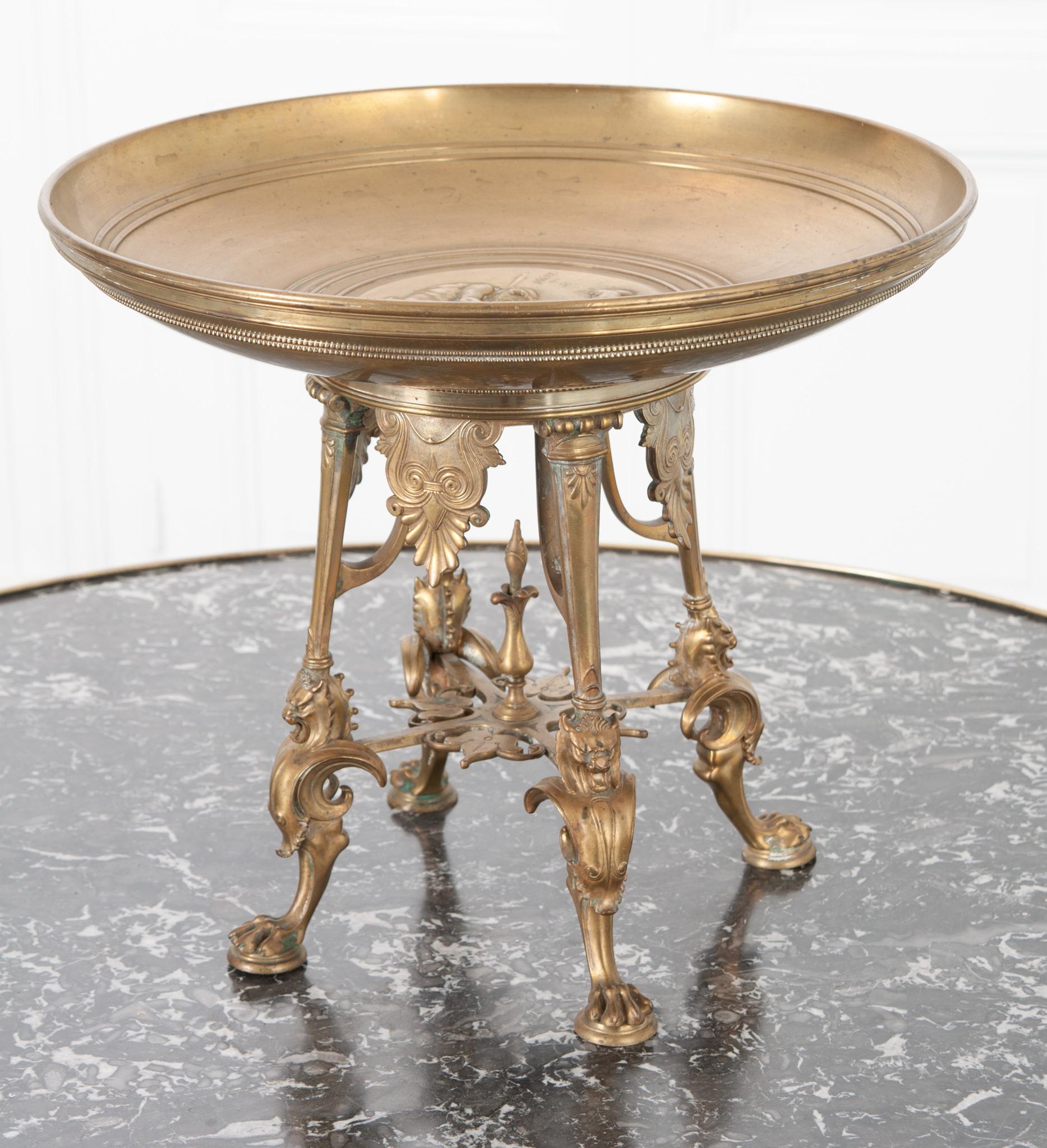 This unique and large solid bronze bowl is from 19th century France. Tazza bowls were once a common feature of dining sets, used as a decorative serving dish. An intricate motif of the Greek legend of Pandora graces the center of the bowl and has a