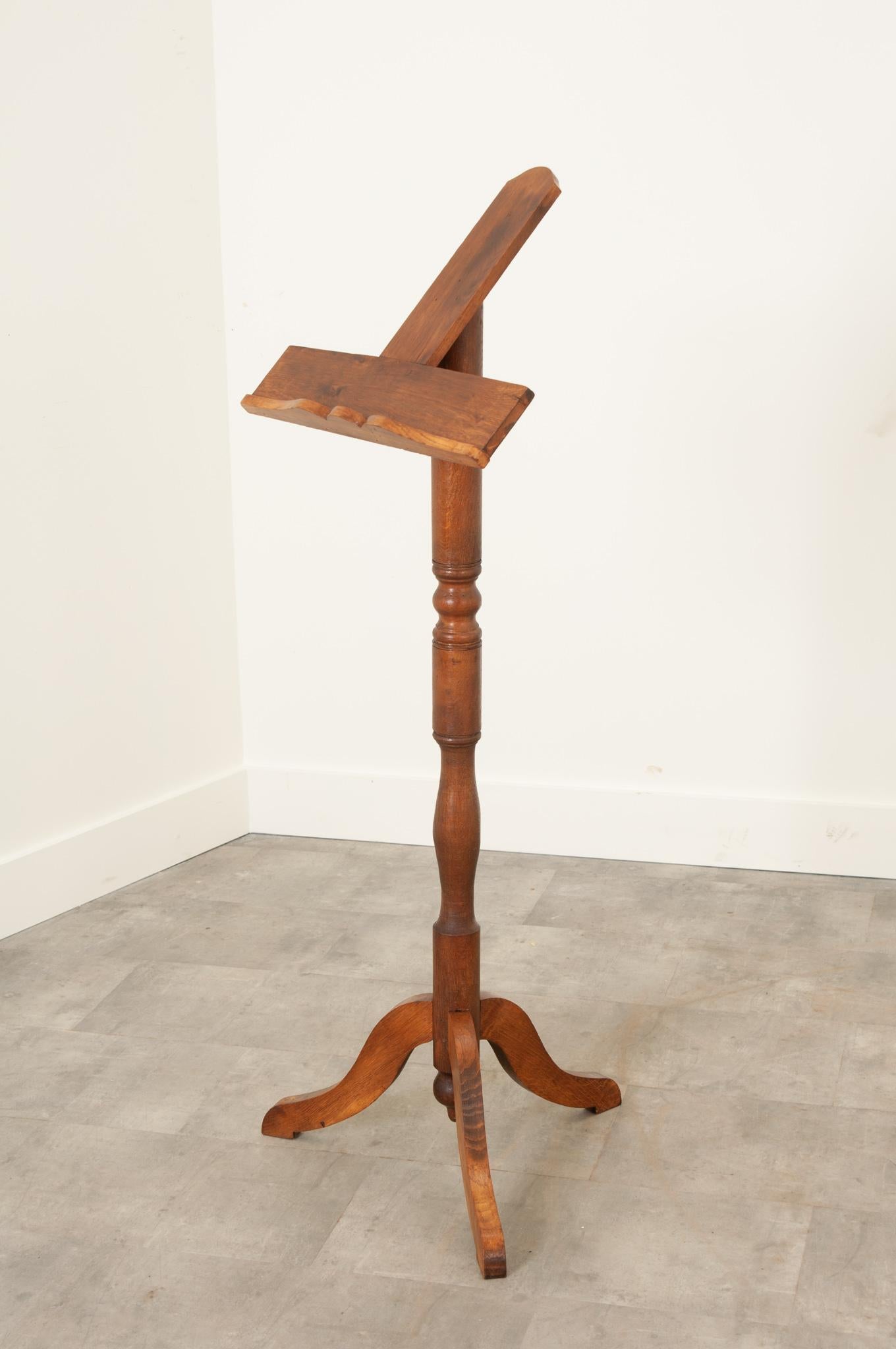 A wonderful music or book stand, made in France towards the end of the 19th century. The uncomplicated design is a testament to turned wood, with its post made of solid oak, which has been turned in a classic balustraded form. The oak has been
