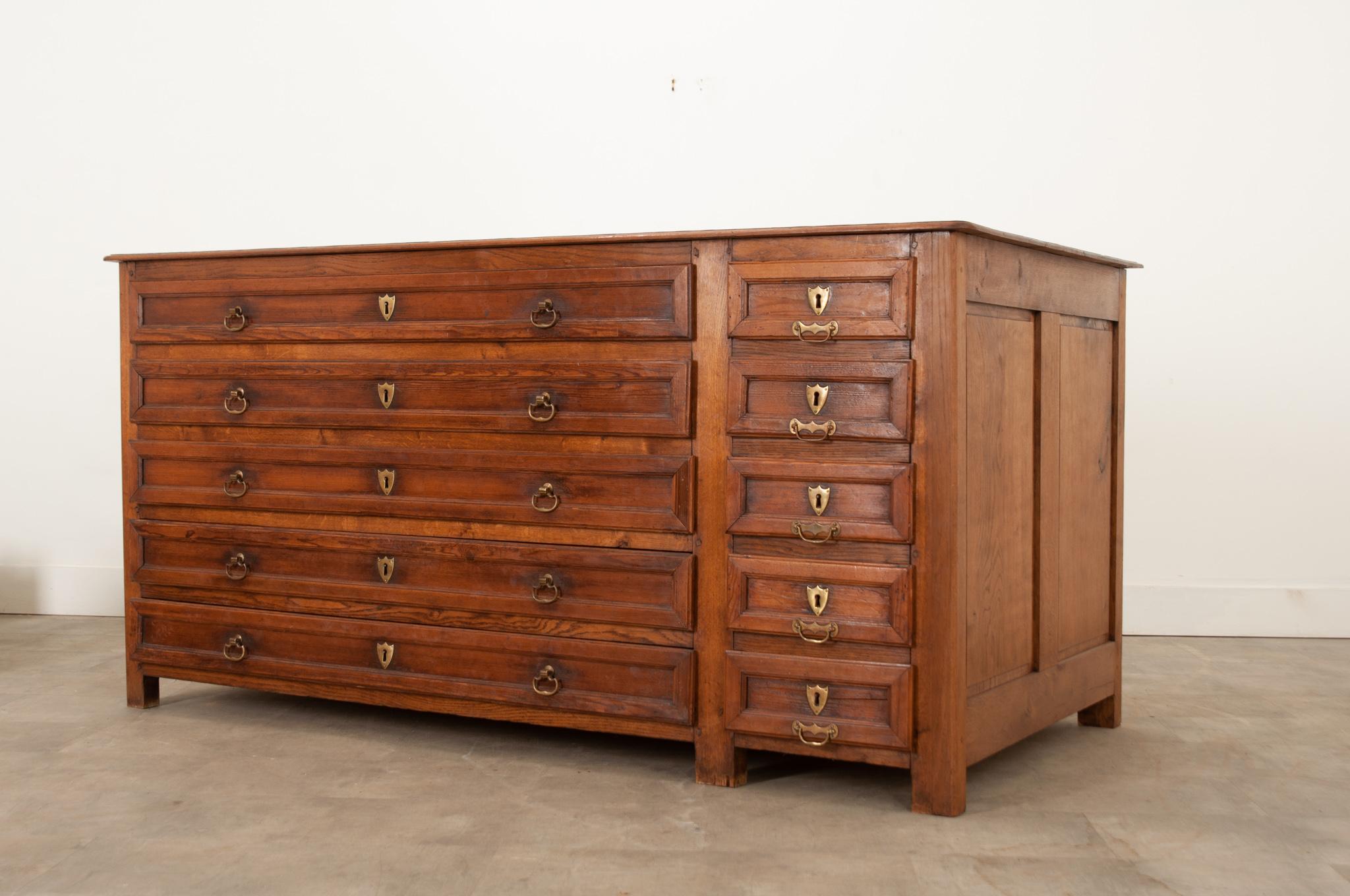 In 18th and 19th century Europe, sacristy or vestment cabinets were used to store liturgical garments, robes, wine and other articles associated primarily with the Christian religion. This superb and rare vestment cabinet made of solid oak is