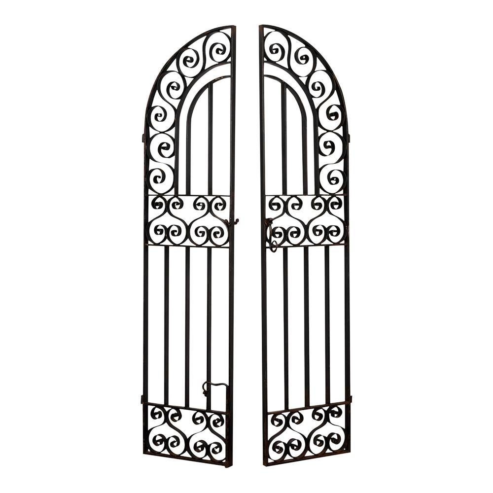 This stunning Spanish style wrought iron gate dates to around the 1840s. The gate doors are decorated with scroll design and its original black paint with rust and distressed finish from age. The gate has its original hand locker and hinges in