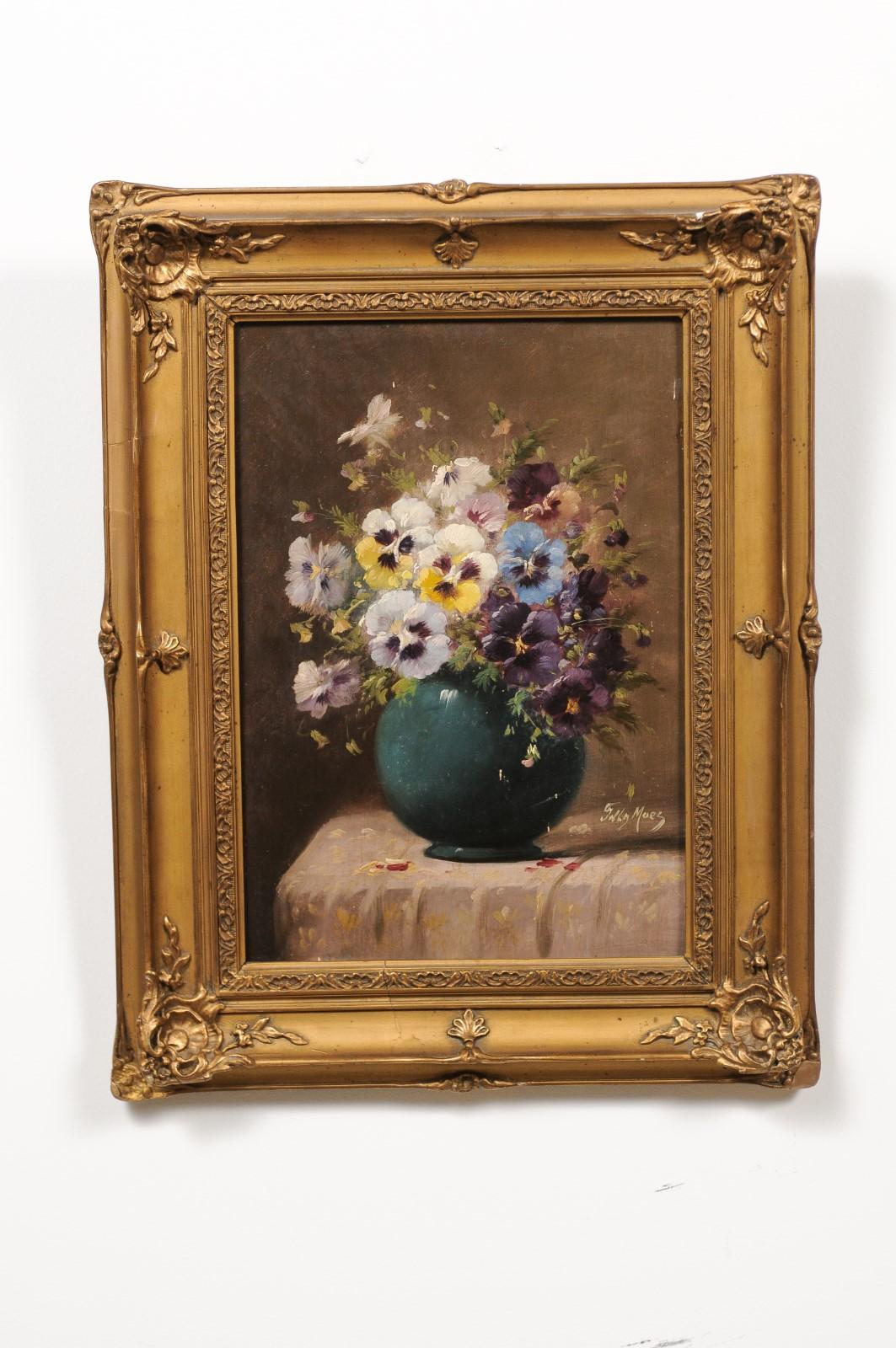 A French framed oil on panel still-life painting from the late 19th century depicting pansies, in giltwood frame. Created in France during the later years of the 19th century, this oil painting depicts a bouquet of pansies displayed in a