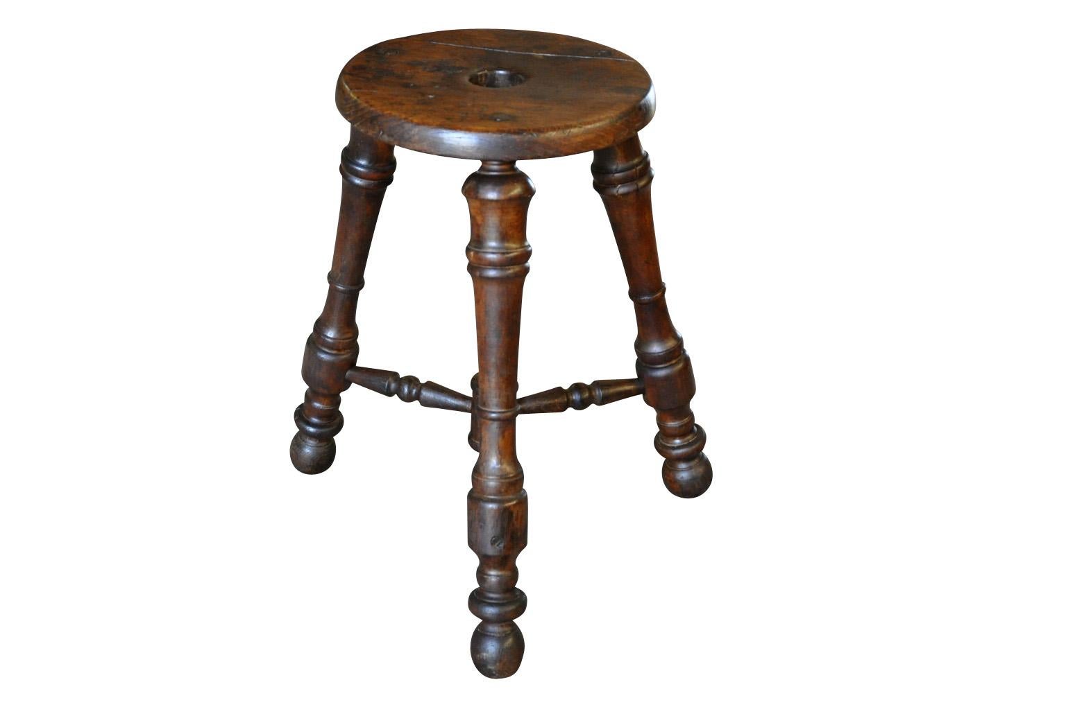 A very handsome French later 19th century stool in richly stained oak. A wonderful accent piece for any casually elegant surrounding.