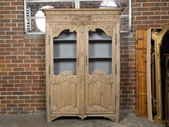 French 19th Century Stripped Wood Bookcase with Carved Scrolling Motifs