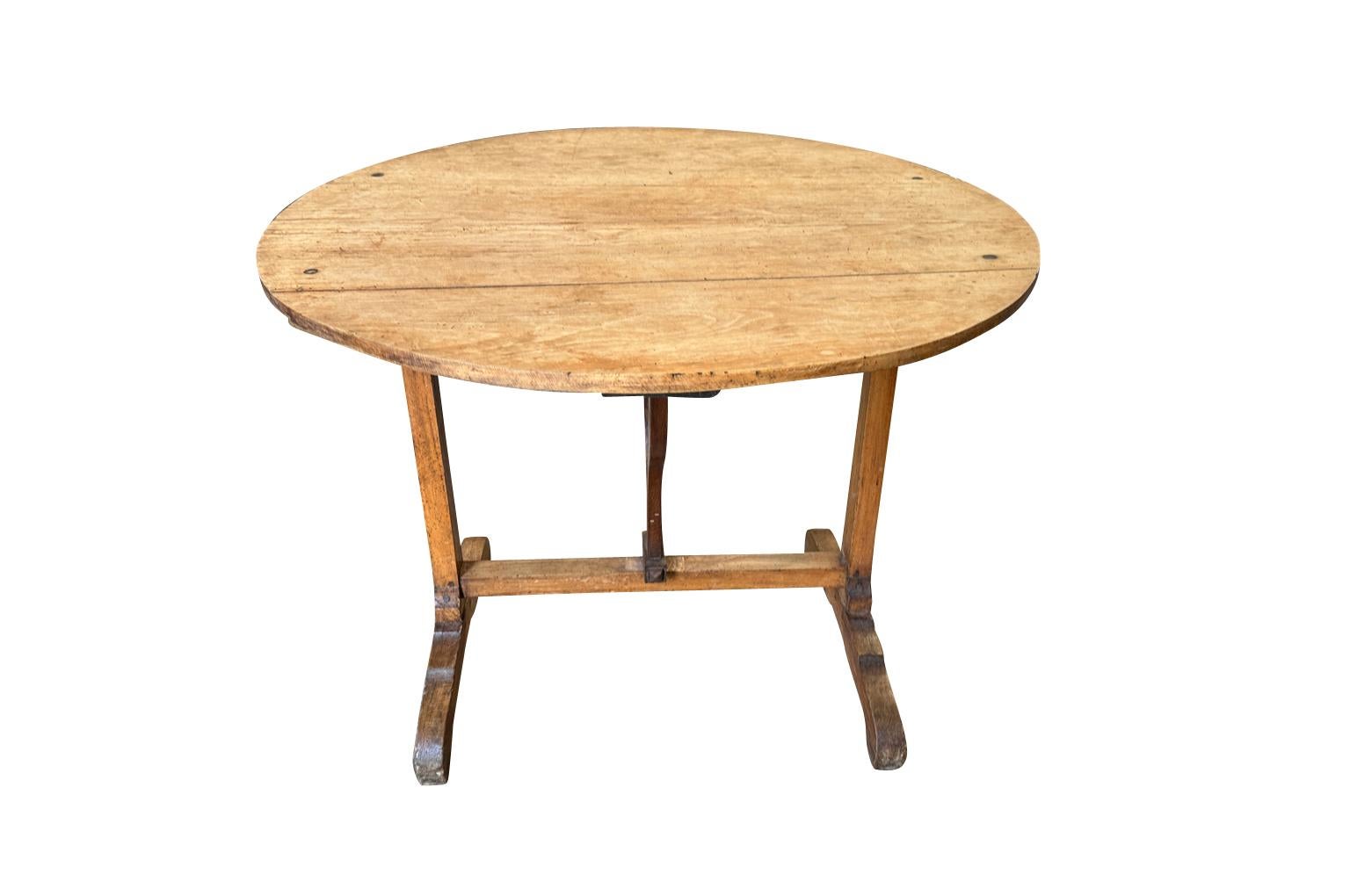 A very charming 19th century Table Vigneron - Wine Tasting Table from the South of France. Beautifully constructed from sturdy oak with a tilting top. 
