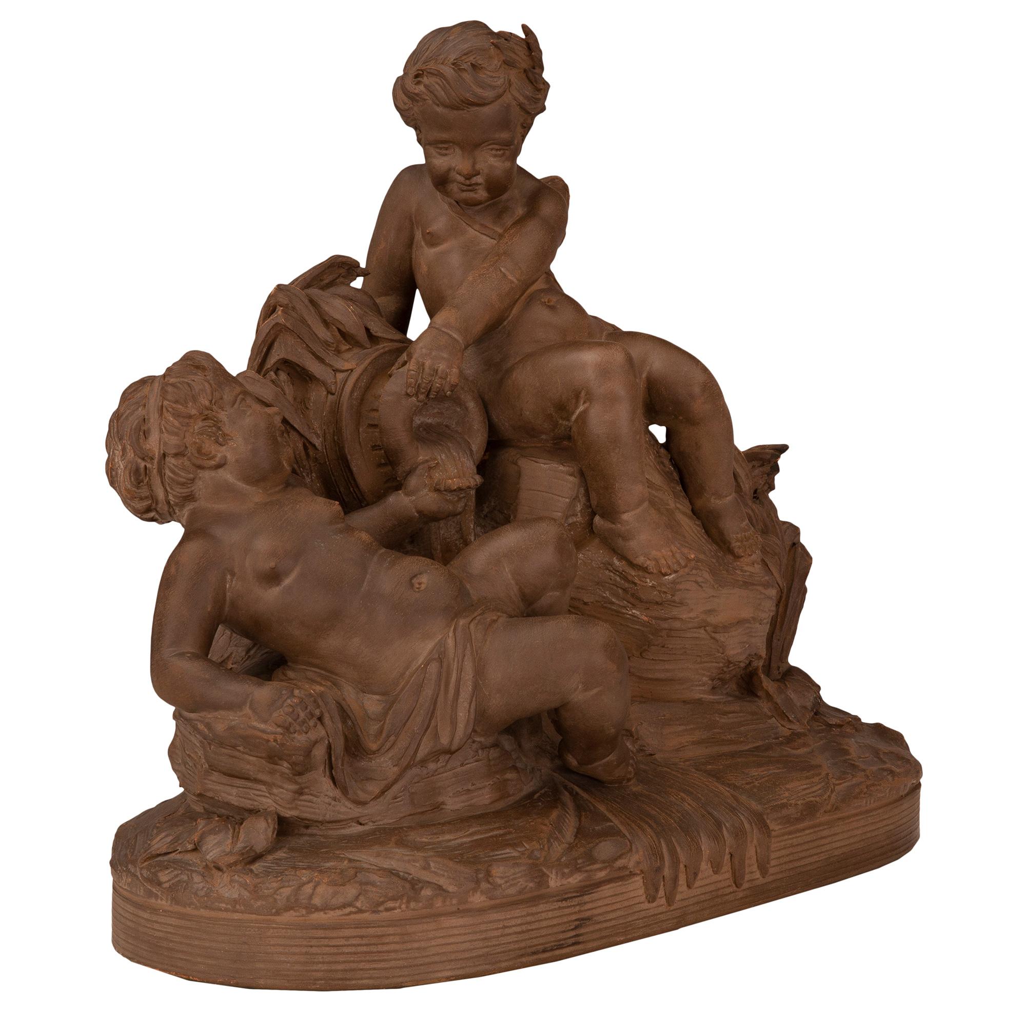 A beautiful and most charming French 19th century terra cotta statue. The statue is raised by a fine oblong base with a lovely wrap around design. Above are two charming winged cherubs seated on rocks pouring water out from a vessel amidst finely