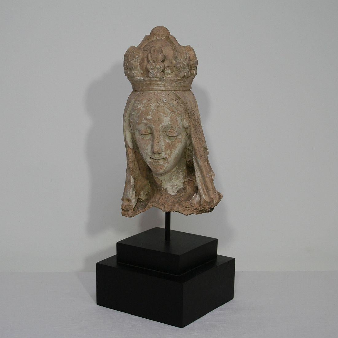 Beautiful and unique find. A terracotta head of a Madonna.
France, circa 1850.
Weathered.
Measurement includes the base.