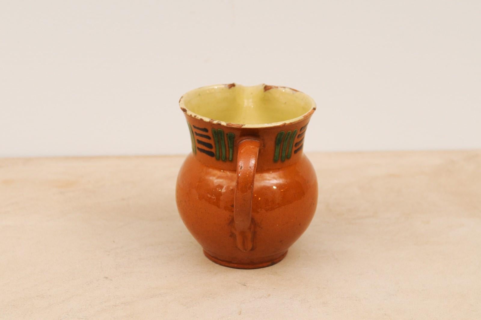 French 19th Century Terracotta Pitcher from Génolhac with Russet Colored Glaze For Sale 1