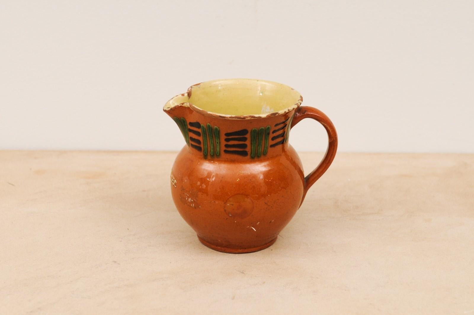 French 19th Century Terracotta Pitcher from Génolhac with Russet Colored Glaze For Sale 3