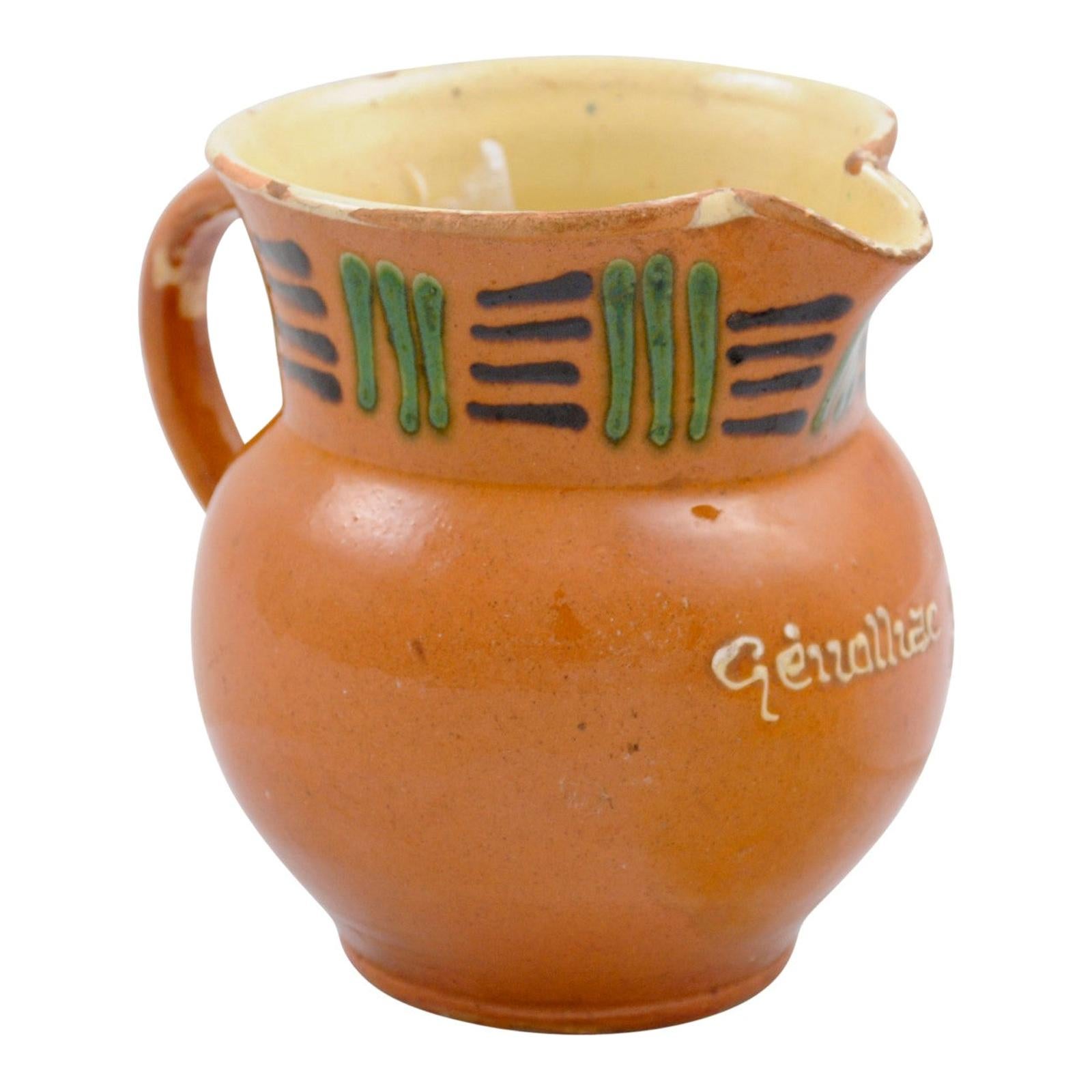 French 19th Century Terracotta Pitcher from Génolhac with Russet Colored Glaze For Sale