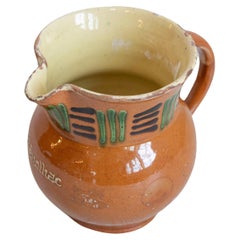 French 19th Century Terracotta Pitcher from Génolhac with Russet Colored Glaze
