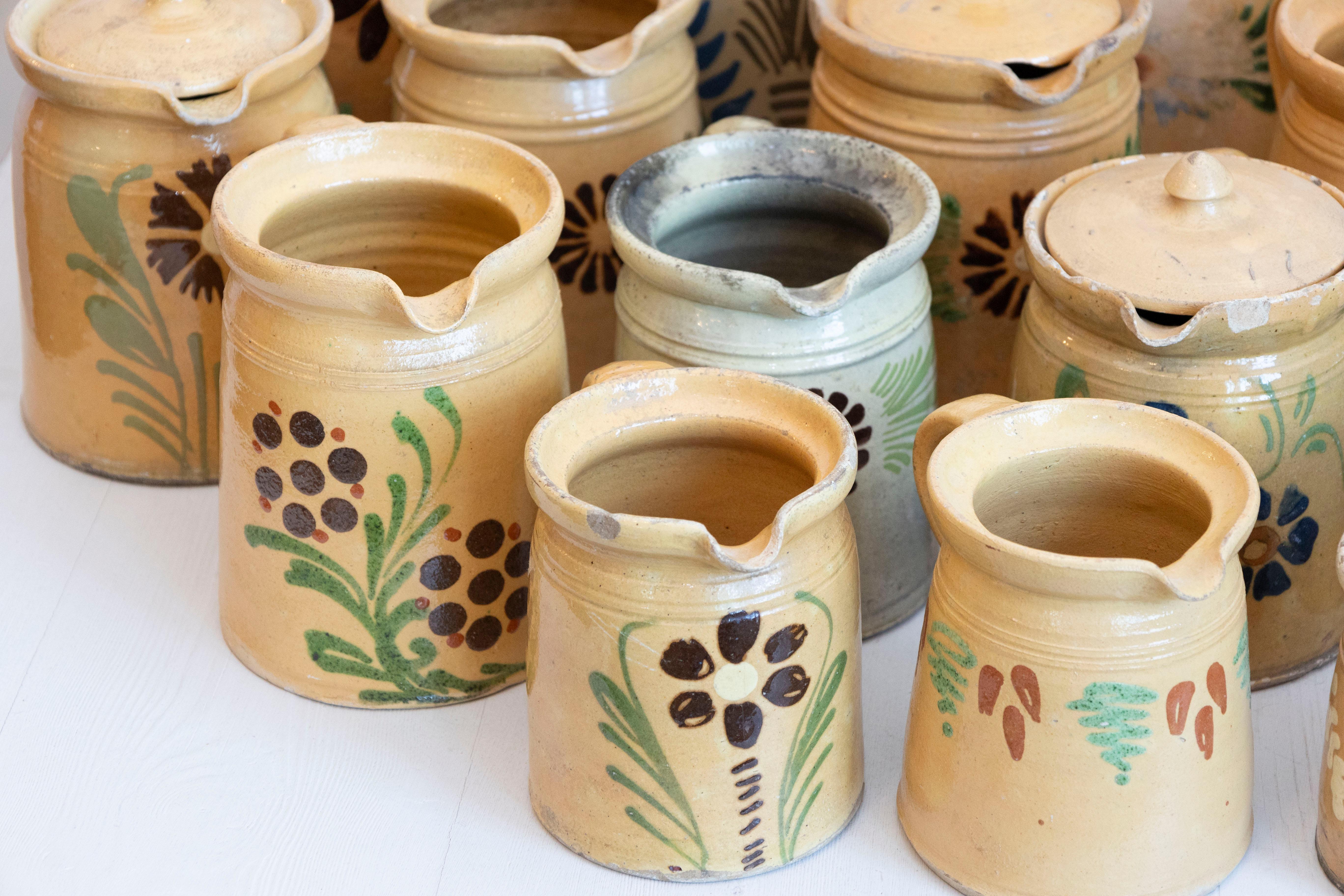 Rustic French 19th Century Terracotta Pottery Pitchers with Floral Decor, Sold Each For Sale