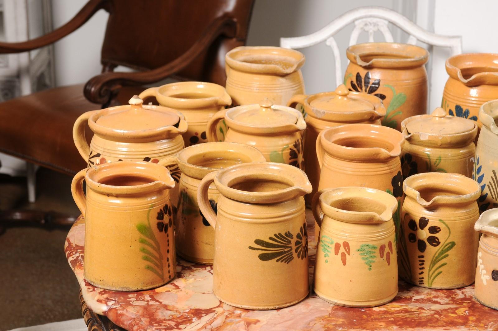French 19th Century Terracotta Pottery Pitchers with Floral Decor, Sold Each In Good Condition For Sale In Atlanta, GA