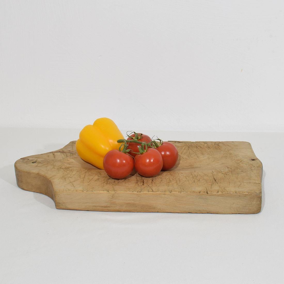 Unique thick wooden chopping-cutting board with a beautiful form. Great statement on your countertop,
France, circa 1850-1900
Weathered. If needed items were treated against woodworm.