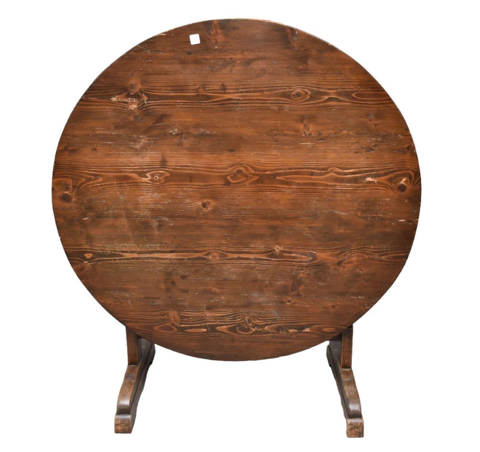 19th century French tilt-topped wine tasting table. Used by wine-makers throughout France, these tables feature the ability to be stored away when not in use due to the tilting mechanism that allows its top to be positioned in upright orientation.