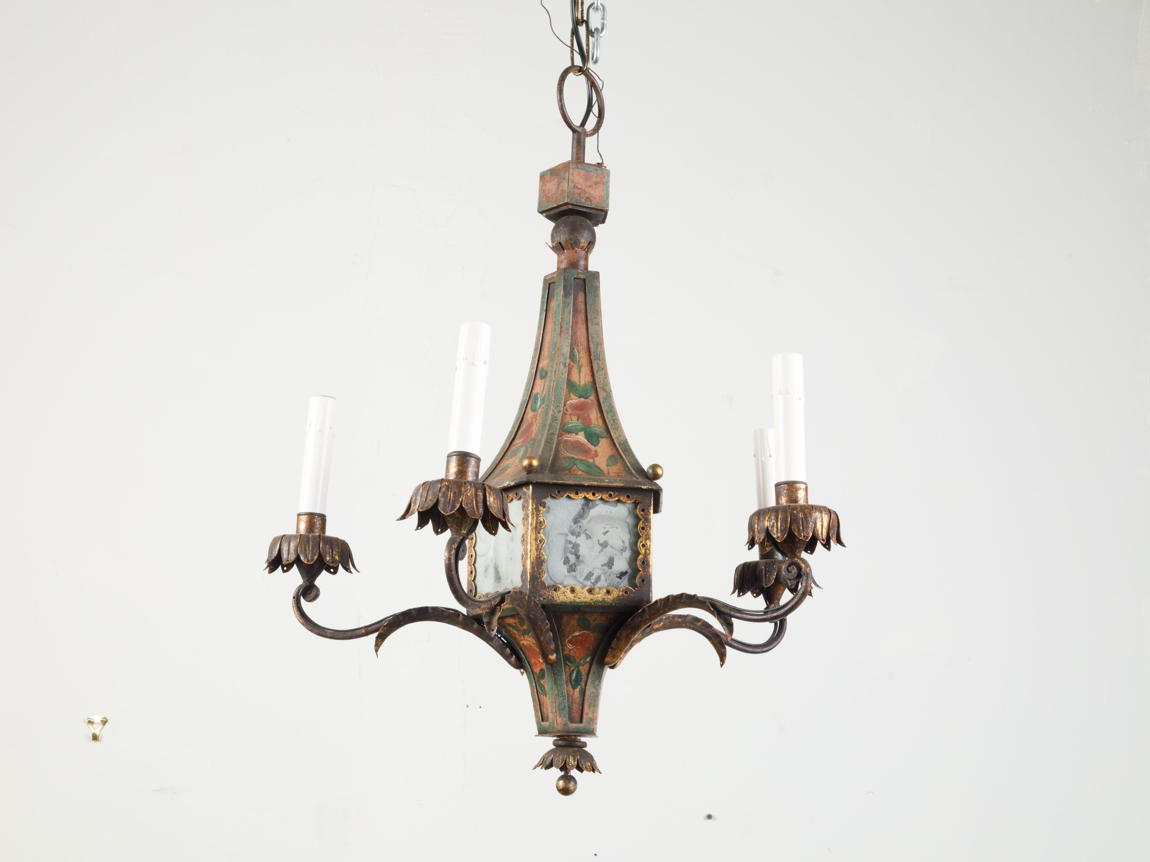 A French five-light tôle chandelier from the 19th century, with painted floral décor. We currently have two chandeliers available, priced and sold $3,750 each. Created in France during the 19th century, this chandelier features a tôle structure