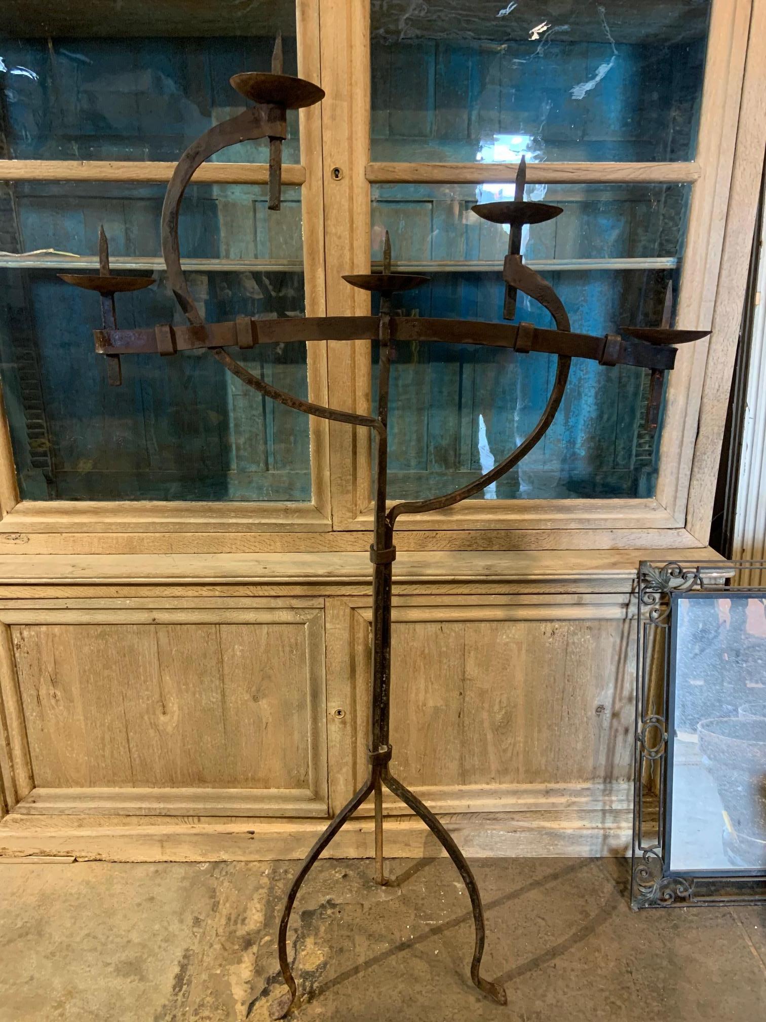 A very intriguing later 19th century French torchère - Standing candelabra - in expertly hand forged iron. A beautiful art piece.