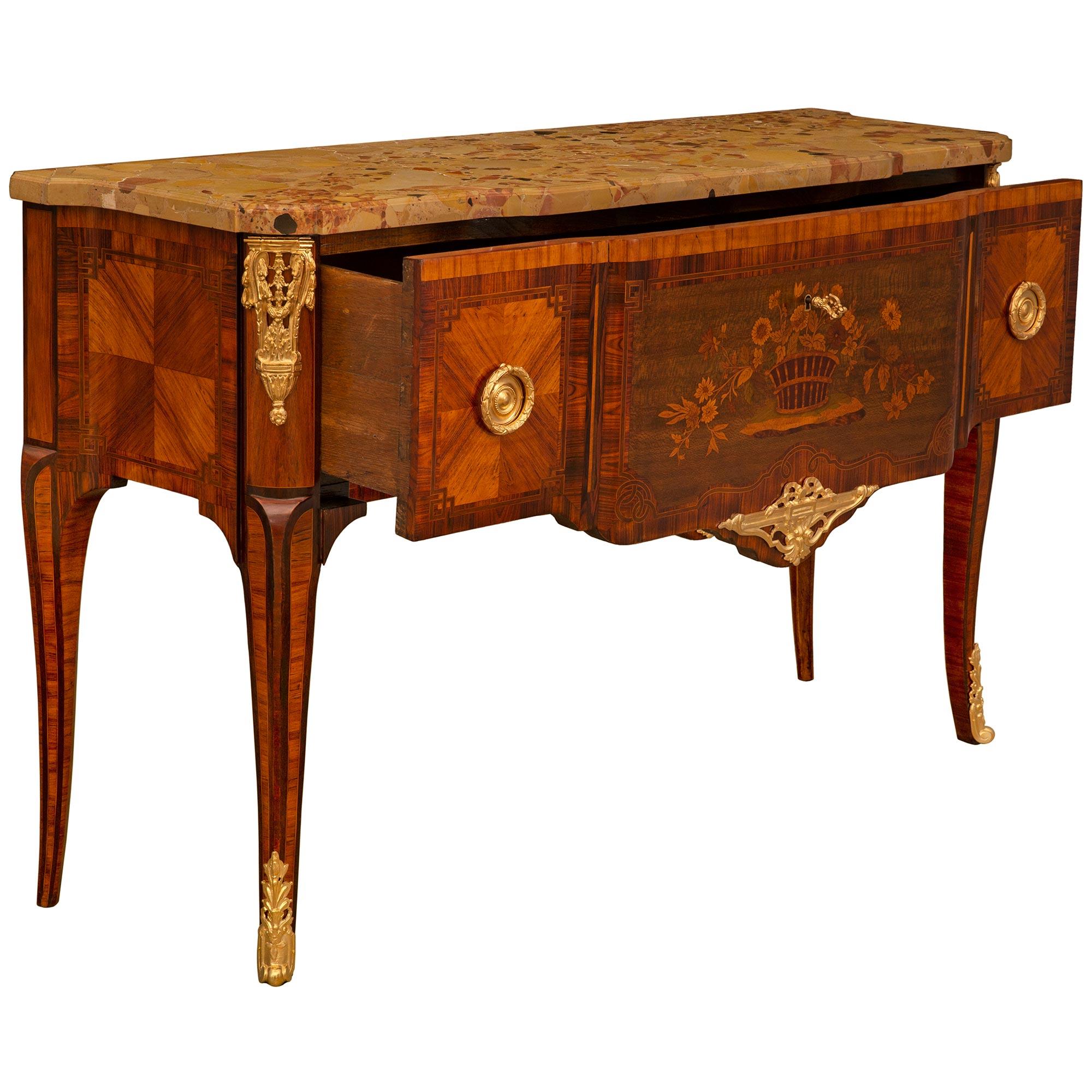 A very unique and high quality French 19th century Transitional st. Ormolu, Tulipwood, Charmwood, Kingwood, and Breche D'Alep marble 'Perruquier' chest, stamped Henry Pannier. This high quality single drawer chest is raised by four square slender