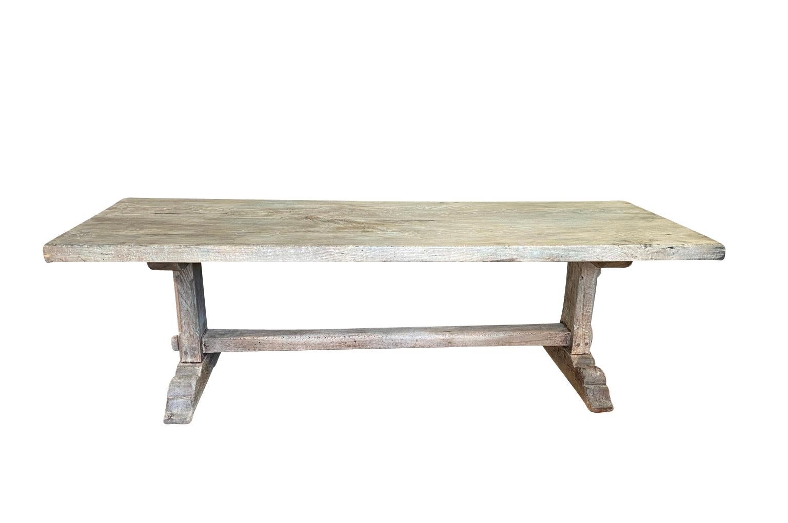 A very charming late 19th century trestle table - farm table from the Provence region of France. Wonderfully constructed from oak with a thick top. Terrific patina.