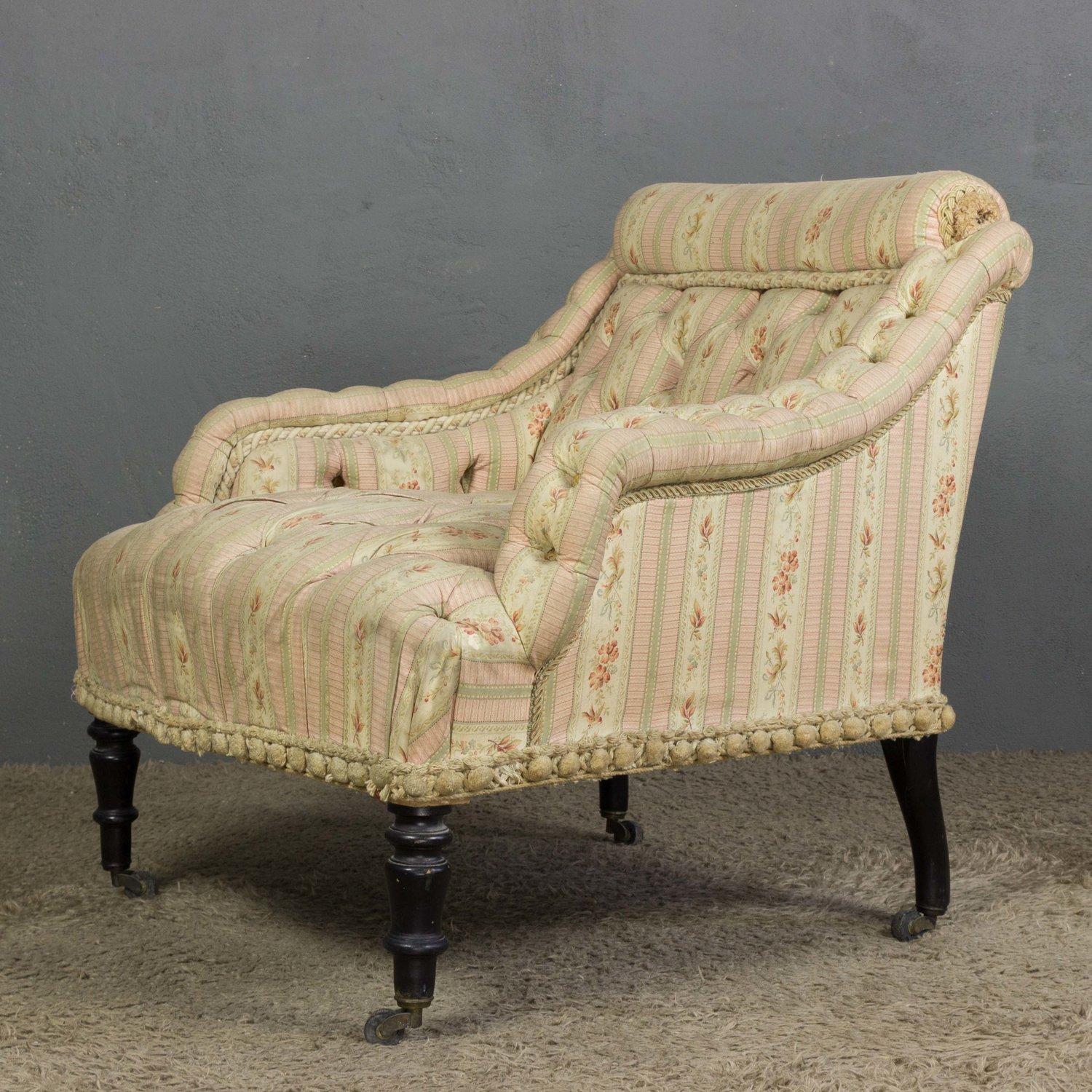 A lovely French 19th century tufted armchair. Vintage and timelessly elegant, this chair will bring a Classic touch of charm to any interior. Upholstered in vintage pink fabric with a beautiful floral stripe, this piece is detailed with trim, and