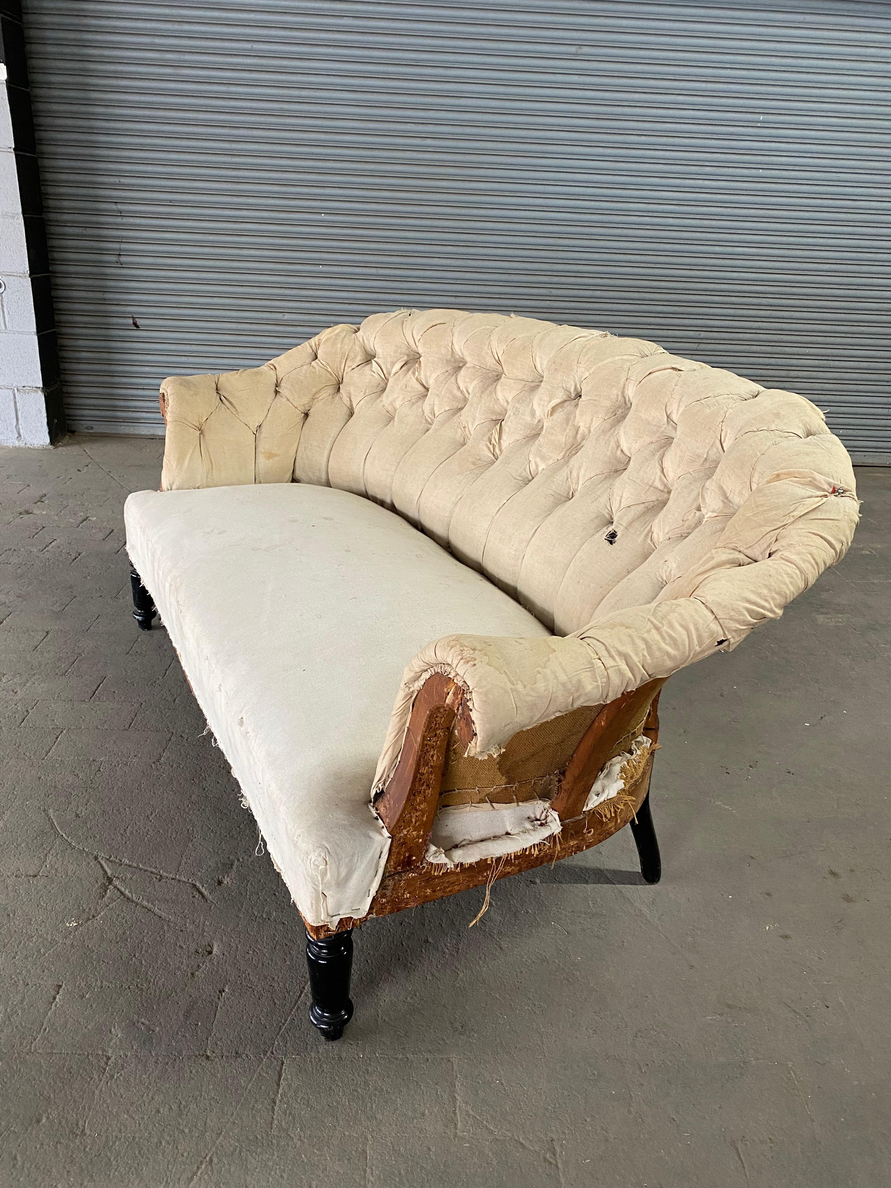 rolled arm tufted sofa