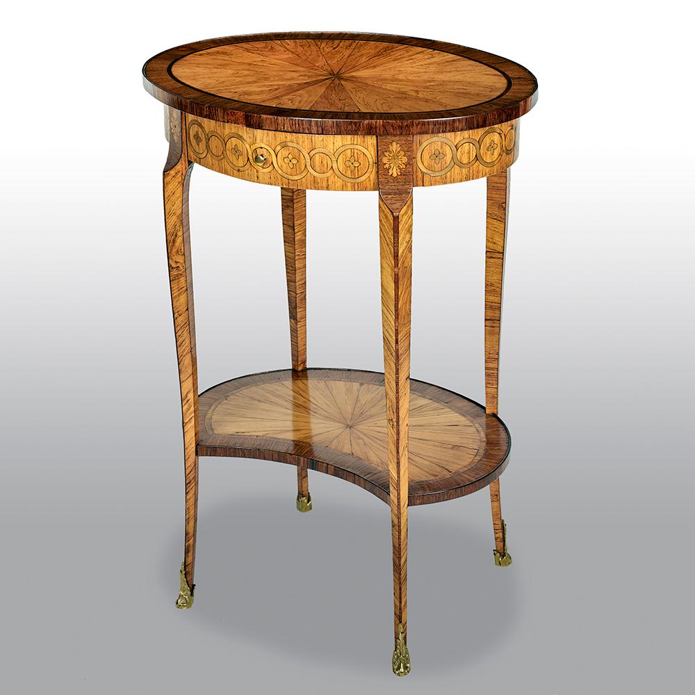 An exceptional late French 19th century side table with tulipwood veneered oval top, and kingwood and ebony border. Below a single drawer with marquetry frieze and slender cabriole legs, supporting a tulipwood kidney shaped lower tier finished with