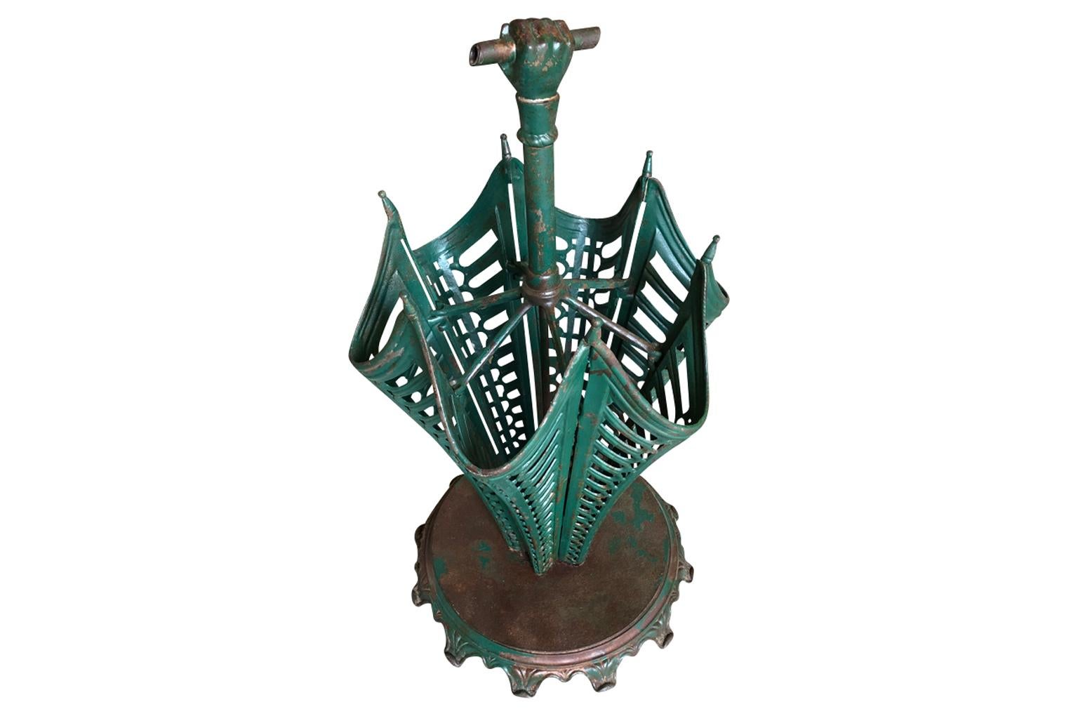 A charming later 19th century French umbrella stand in wonderful painted cast iron.