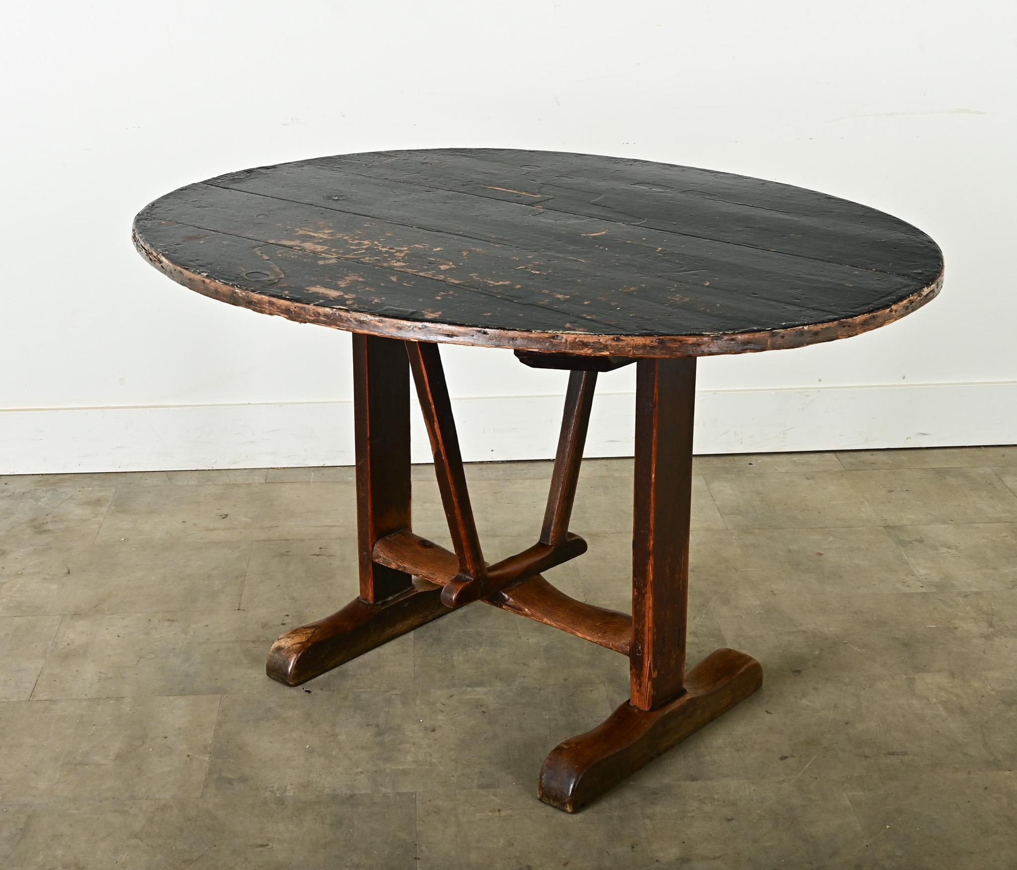 This wine tasting – or vendange – table was made in the 19th century in France, by a unique process of layering cheesecloth and candle wax on the wood planks to create a smooth but durable table top finish. Used by wine-makers throughout France and