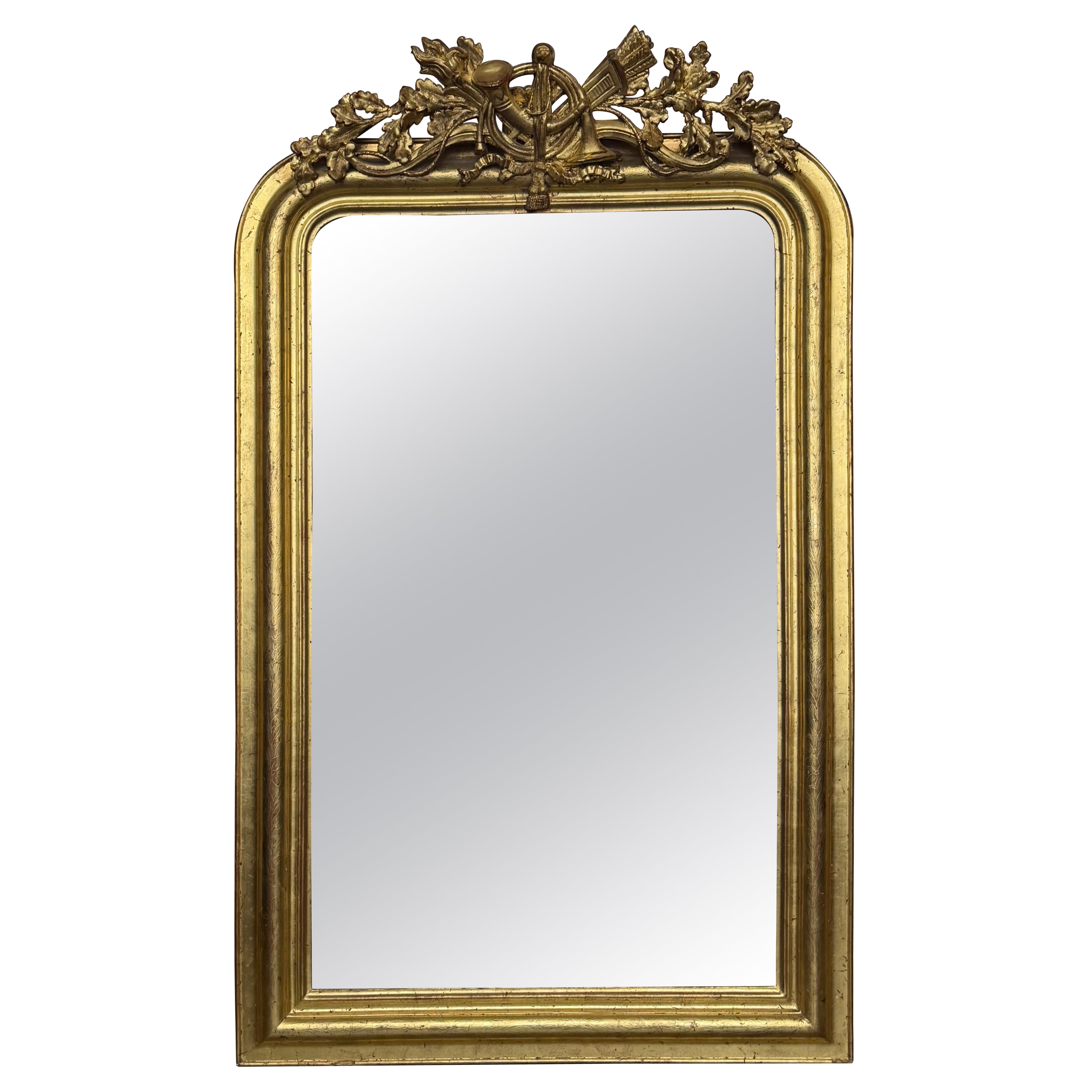 French 19th Century Vertical Gold Gilt Mirror with Floral crest For Sale