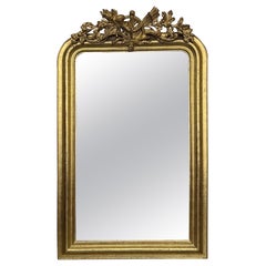 French 19th Century Vertical Gold Gilt Mirror with Floral crest