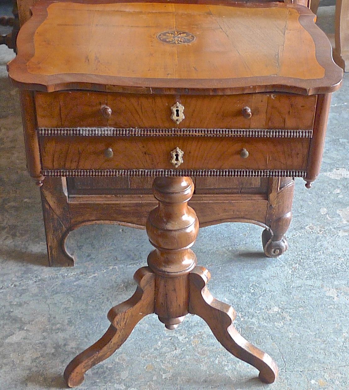 French 19th century walnut 2-drawer sewing table with inlay top and 2 drawers. The top has been repaired.
  