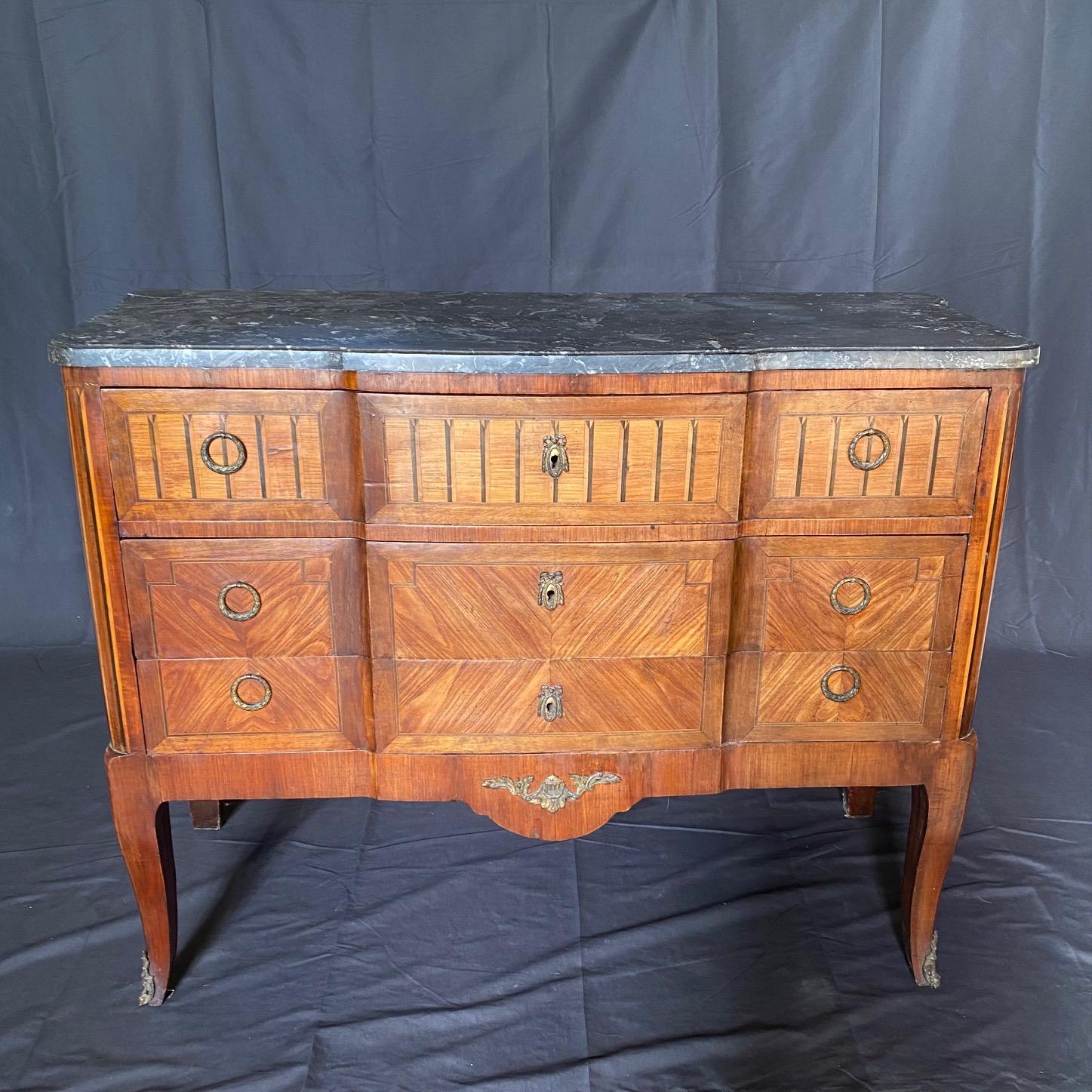 Elegant and practical 19th Century French neoclassical commode secretary, meticulously crafted from walnut veneer and adorned with exquisite inlaid wood detailing.  Whether used as a writing desk or a statement piece in your living room or study,