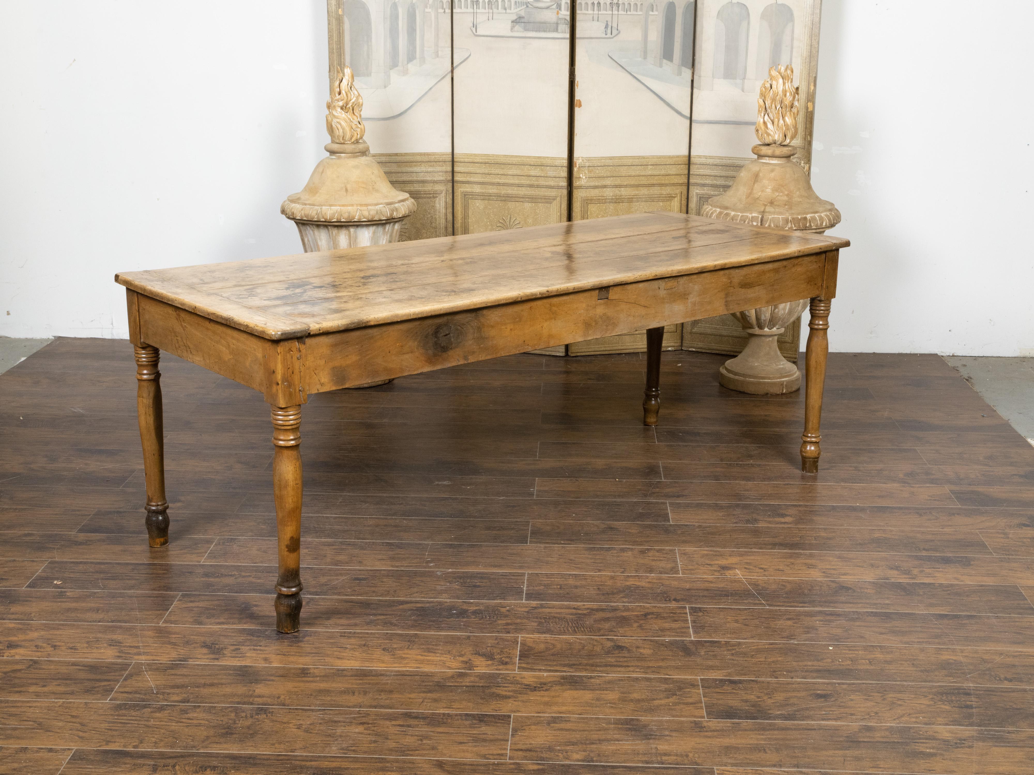Rustic French 19th Century Walnut Farm Table with Turned Legs and Distressed Patina For Sale