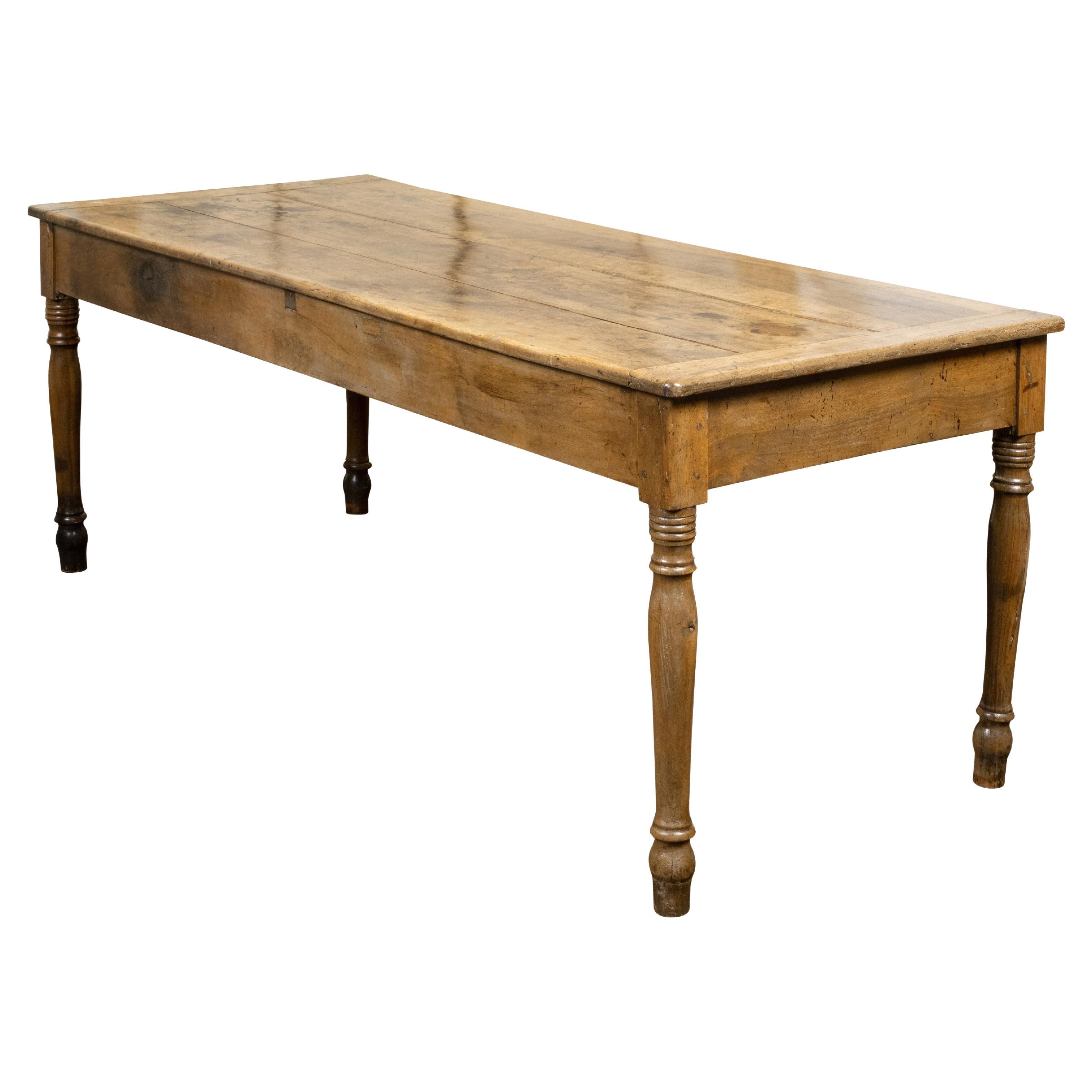 French 19th Century Walnut Farm Table with Turned Legs and Distressed Patina For Sale