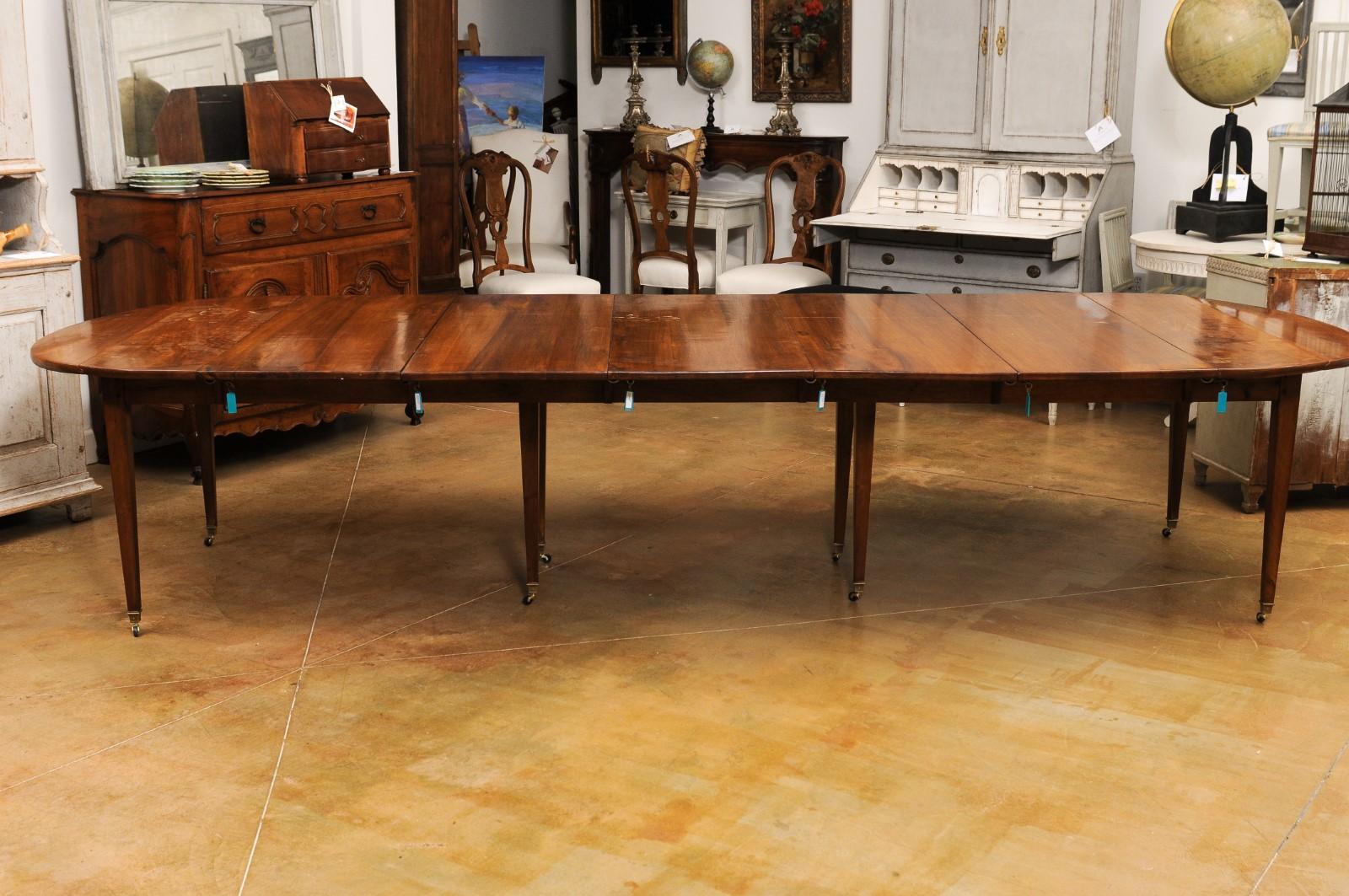 French 19th Century Walnut Oval Extension Dining Table with Five Leaves 8