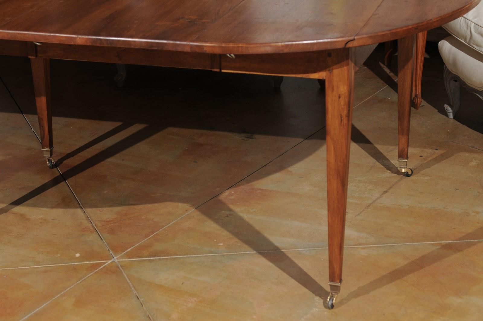 Brass ON HOLD French 19th Century Walnut Oval Extension Dining Table with Five Leaves