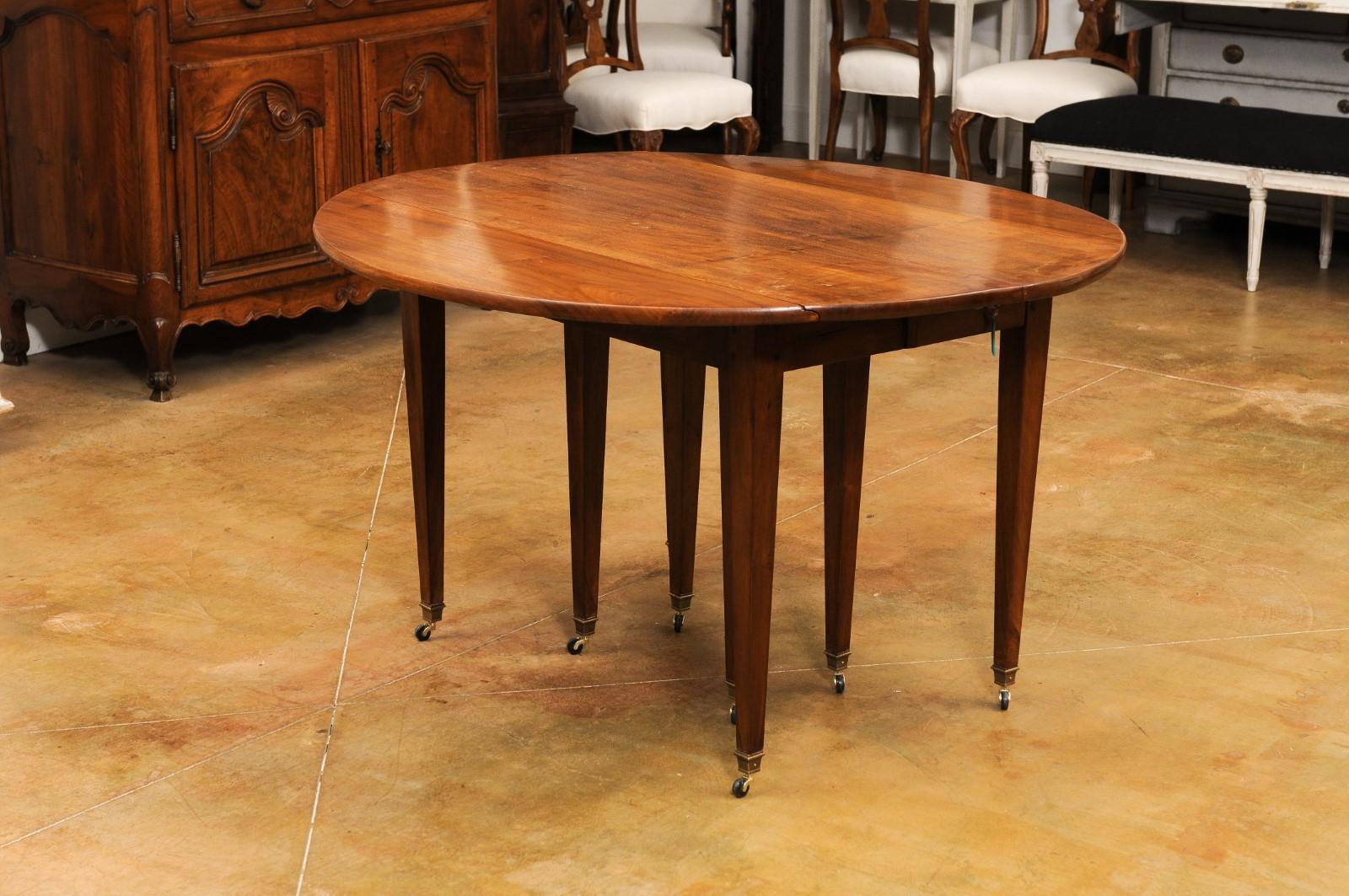 Wood French 19th Century Walnut Oval Extension Dining Table with Five Leaves