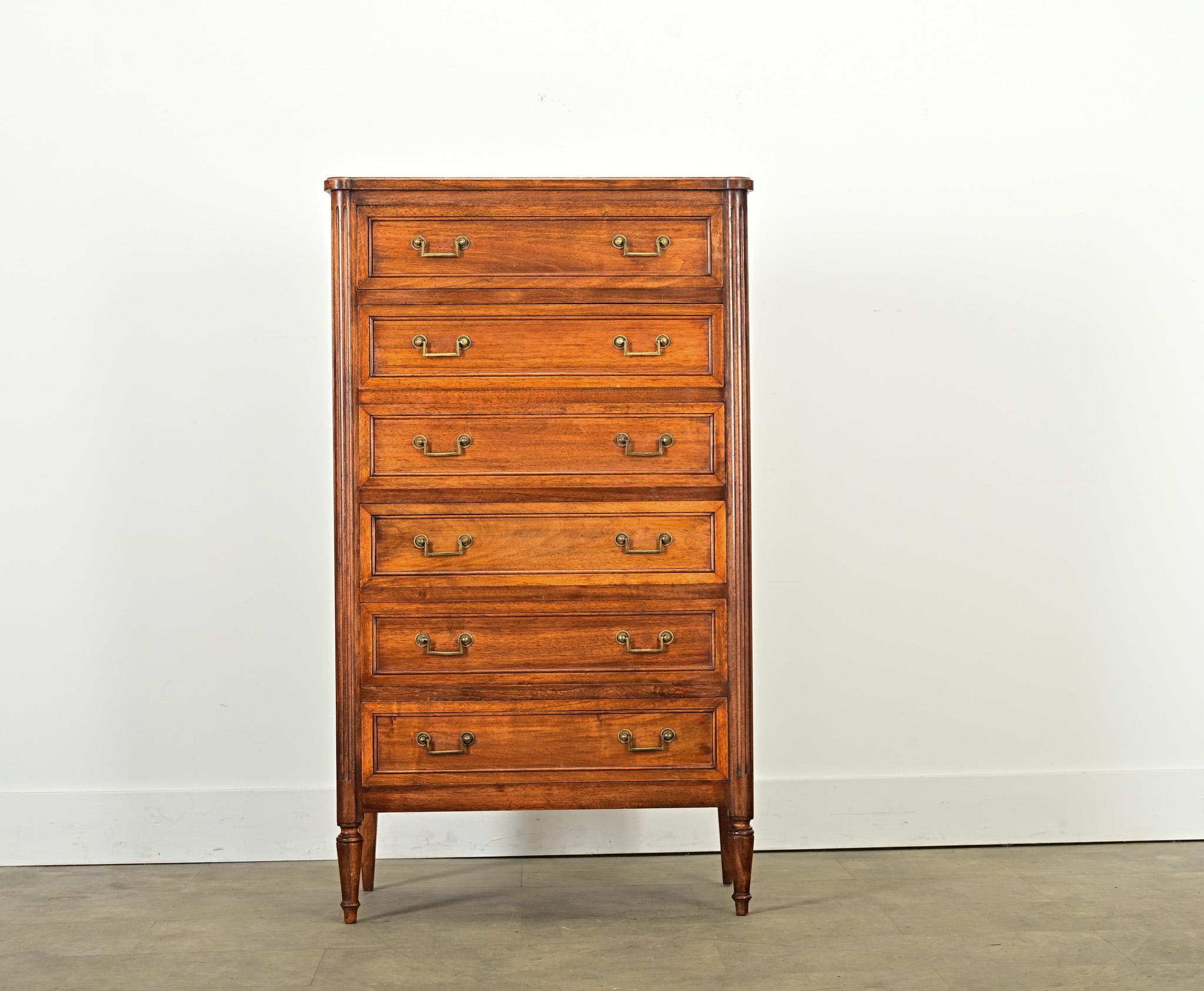 French 19th century Louis XVI-style walnut chest of drawers, almost a semainier except with six drawers instead of the requisite seven. Sometimes referred to as a lingerie chest, the height and narrow proportions would elegantly host the clothing or