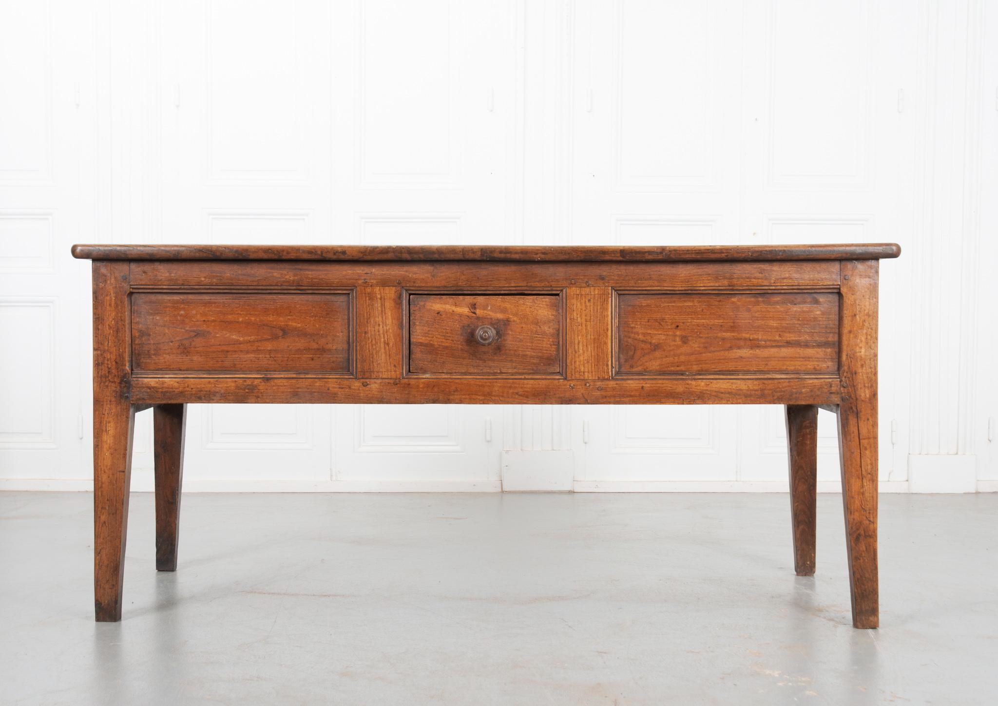 This handsome work table is made of solid walnut and has a great patina. The apron houses a neat set of drawers. A small single drawer with a simple wooden turned knob graces the front. Don’t be fooled though, the sides each house a large drawer for