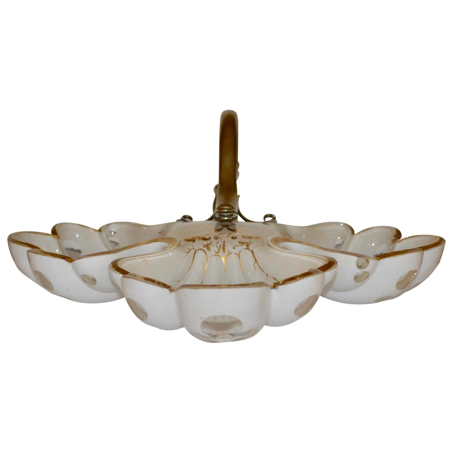 French 19th century white opaline candy dish with brass snake hardware.
The opaline has golden decorations on the edges.