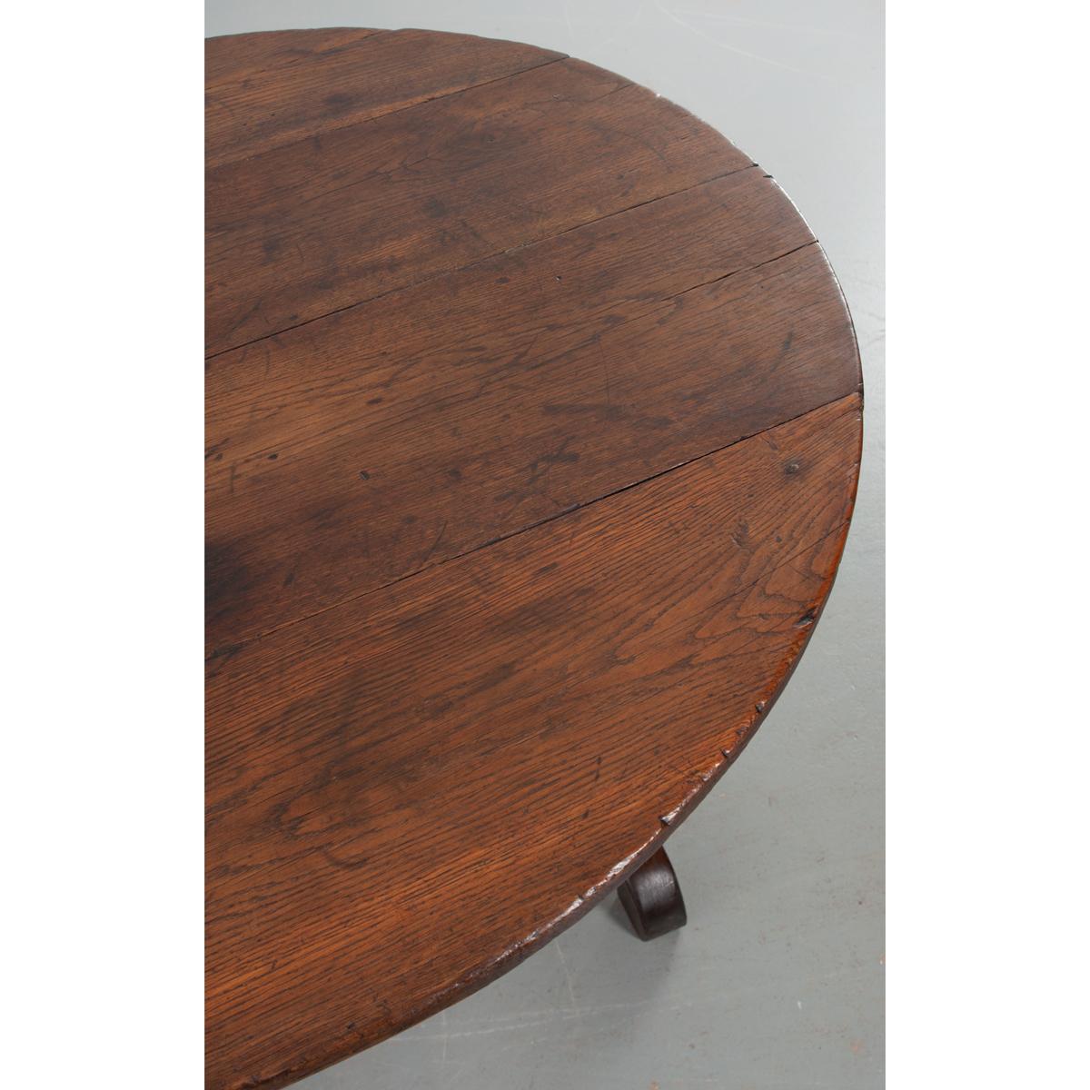 This wine tasting – or vendange – table was made in the 19th century in France. Used by wine-makers throughout France and Europe, these specialized tables feature the ability to be stored away when not in use thanks to the tilting mechanism that