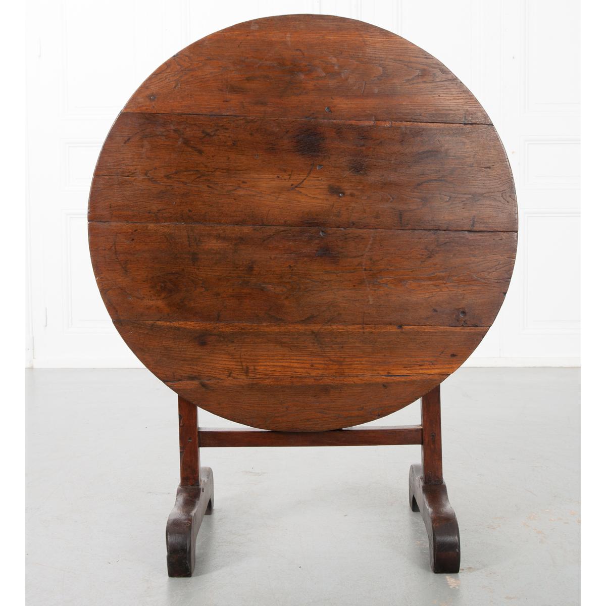 This wine tasting – or vendange – table was made in the 19th century in France. Used by wine-makers throughout France and Europe, these specialized tables feature the ability to be stored away when not in use thanks to the tilting mechanism that