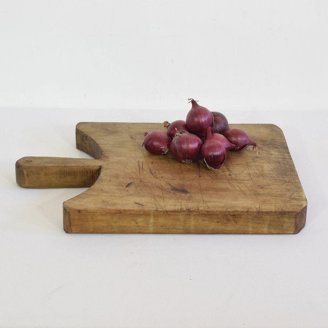 Unique wooden chopping-cutting board with a beautiful form. Great statement on your countertop,
France, circa 1850-1900
Weathered.