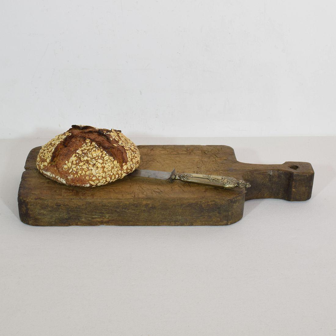 Unique and wooden chopping-cutting board with a beautiful form. Great statement on your countertop,
France, circa 1850-1900
Weathered. If needed items are treated against woodworm.