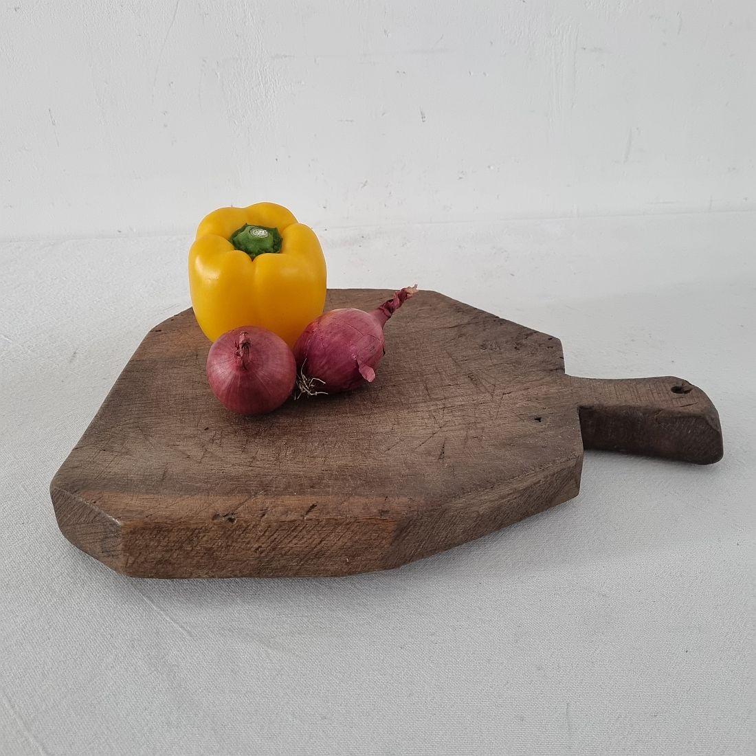 Unique wooden chopping-cutting board with a beautiful form. Great statement on your countertop,
France, circa 1850-1900
Weathered. If needed items are treated against woodworm.