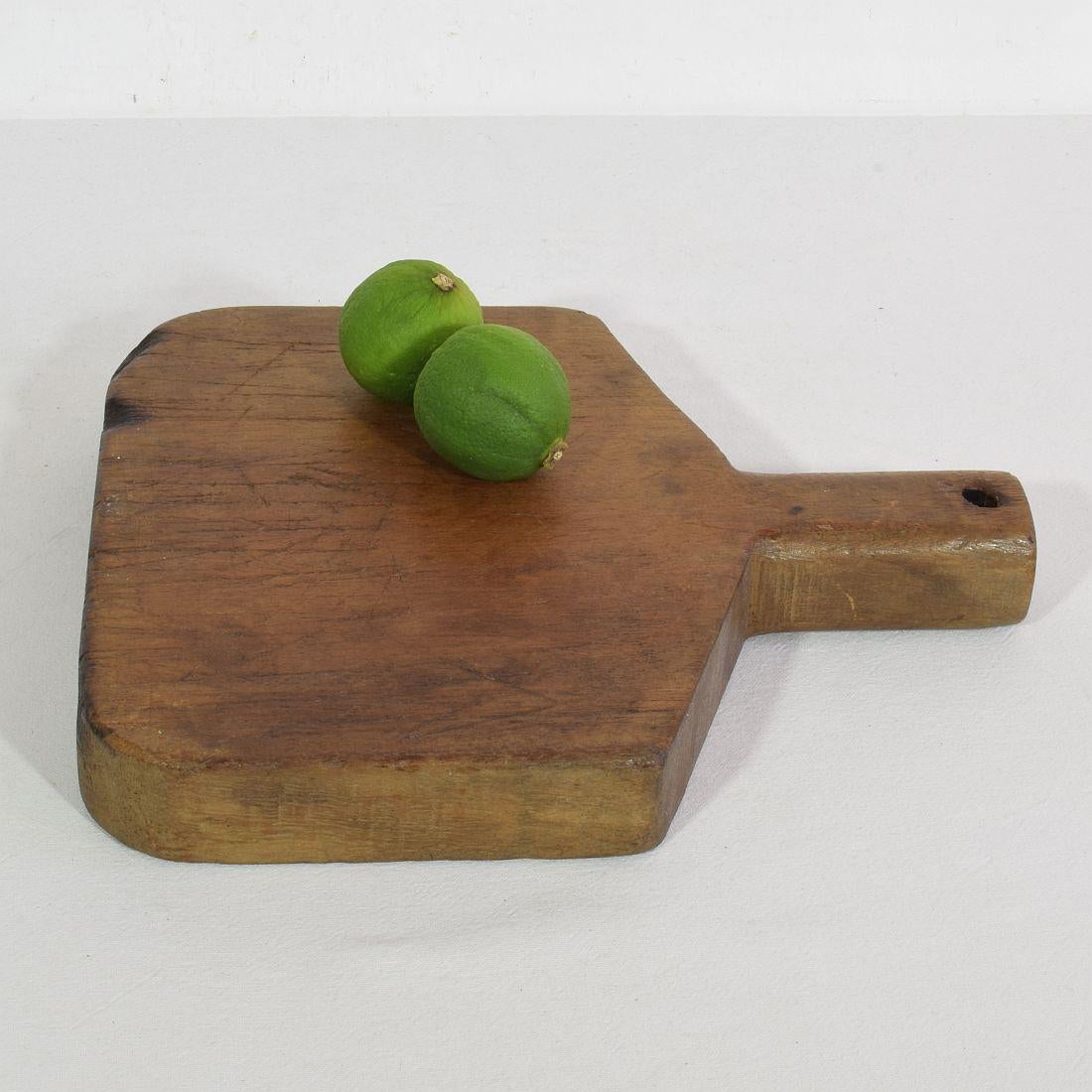 Unique small wooden chopping-cutting board with a beautiful form. Great statement on your countertop,
France, circa 1900
Weathered. If needed items are treated against woodworm.