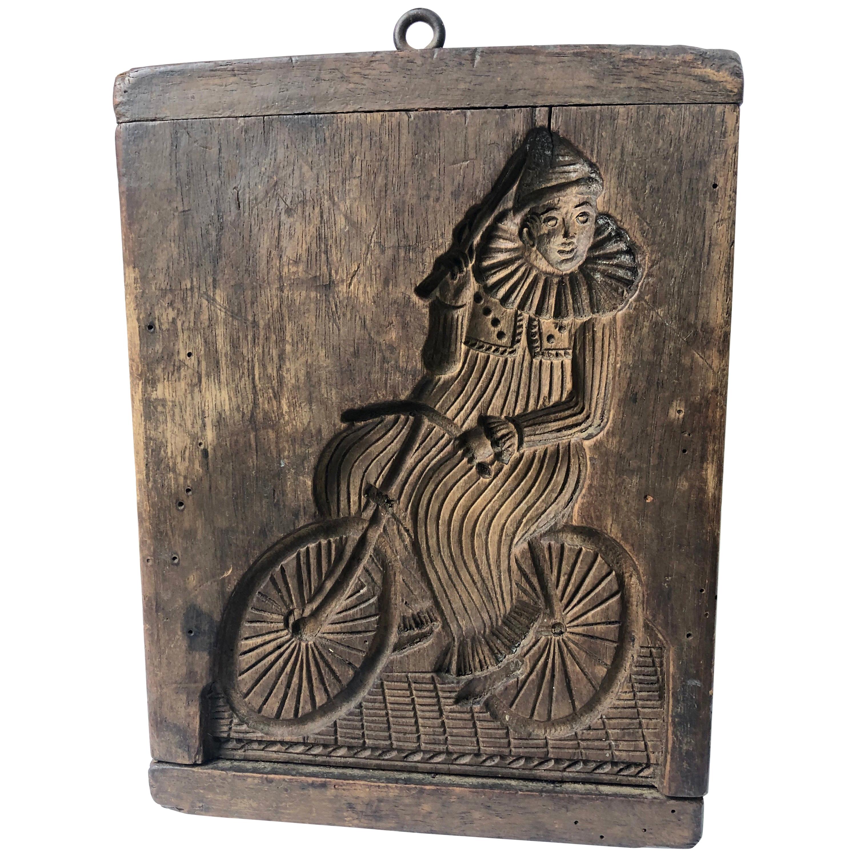 French 19th Century Wooden Cookie Mold, Clown on a Bicycle For Sale