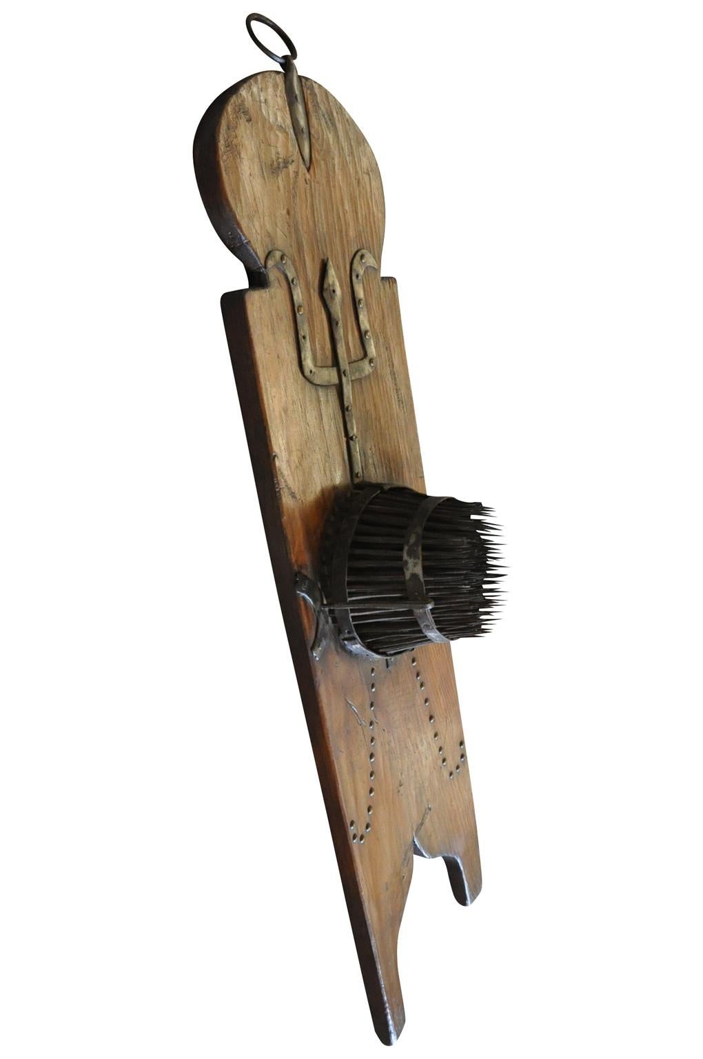 A very charming and unusual mid-19th century Apparatus for combing wool. A terrific decorative accent piece for a rustic environment.